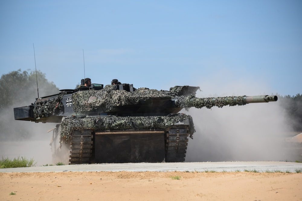 German Army soldiers occupy a firing position in a Leopard 2 main battle tank at a tank range at Pabrade, Lithuania