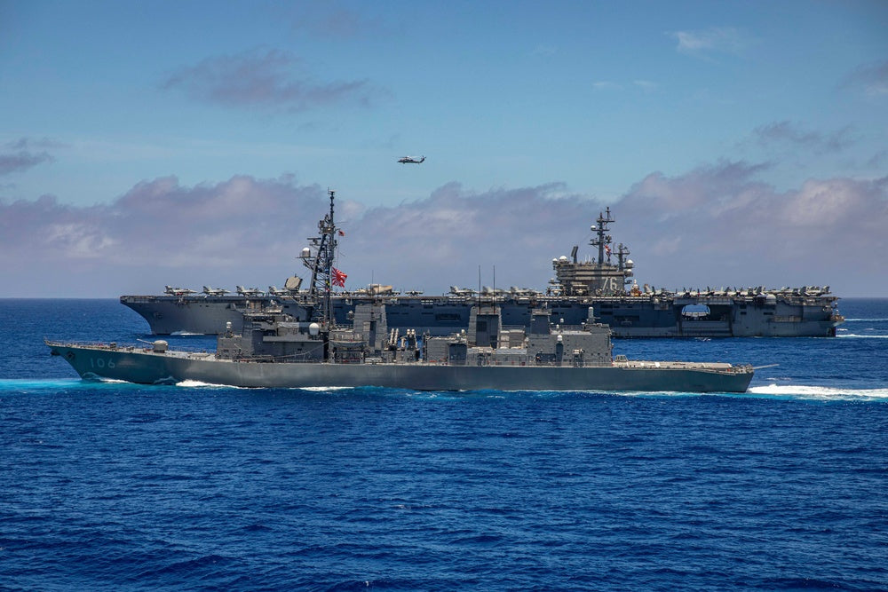 The Nimitz-class aircraft carrier USS Ronald Reagan (CVN 76) and Japan Maritime Self-Defense Force (JMSDF)