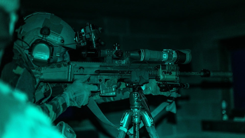 Belgian special operations forces (SOF) sniper engages a target under the cover of darkness at the International Special Training Center’s Urban Sniper Course, June 3, 2021
