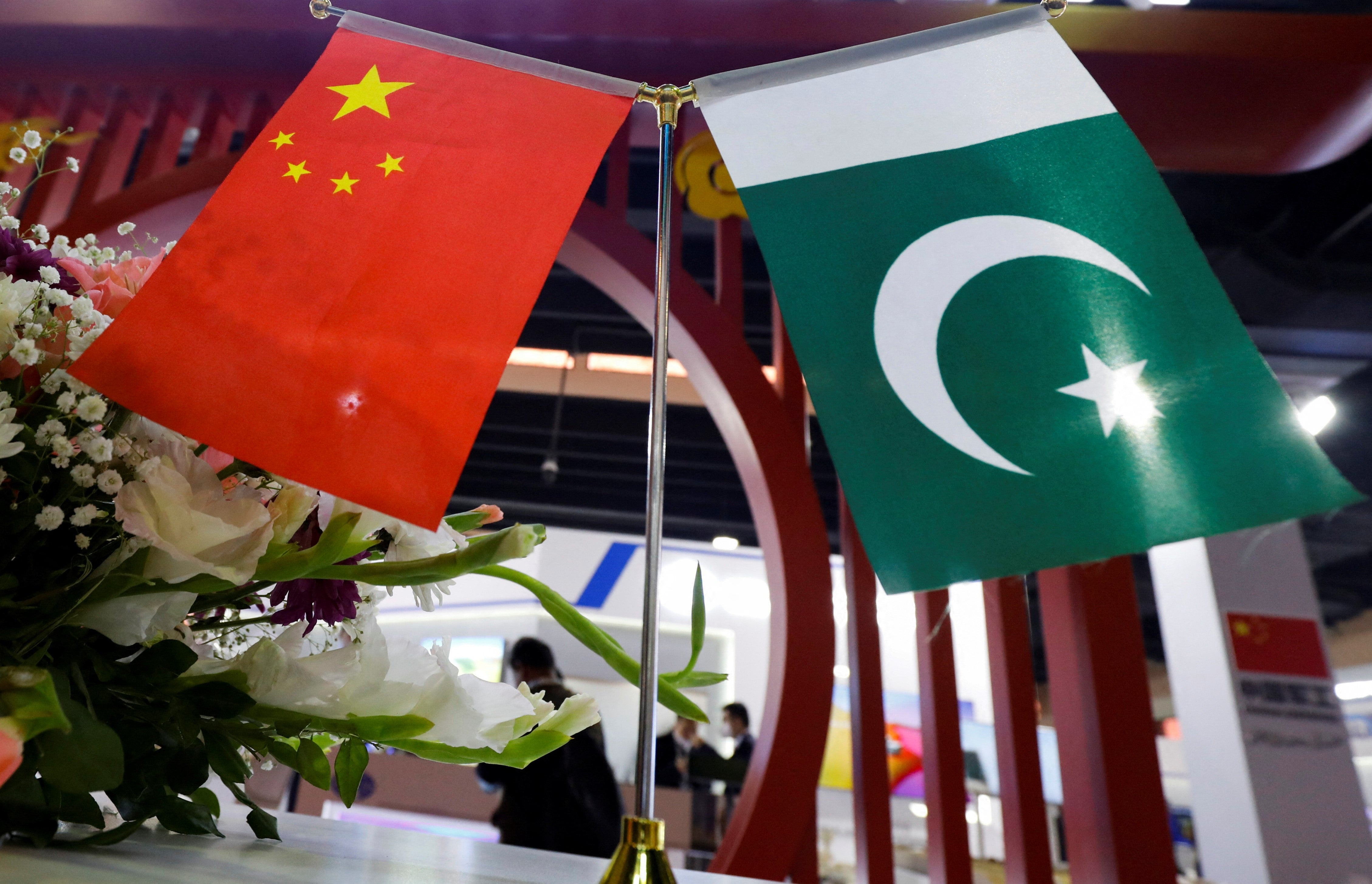 Flags of Pakistan and China are seen at the entrance of the China Pavilion