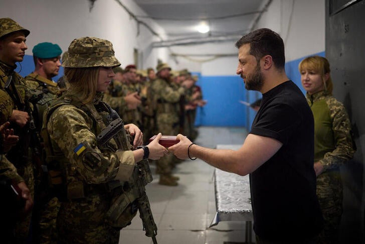 Ukraine says it retakes more ground as Zelenskiy visits front lines