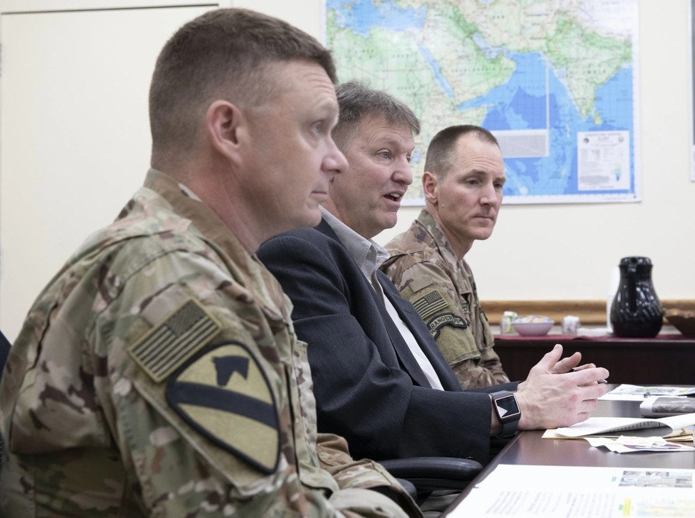 Col. Christopher M. Coglianese, left, deputy chief of staff, U.S. Army Central (Forward), meets with Max D. Lederer Jr., center, publisher, Stars and Stripes, and Col. Simon L. Schaefer, commander, 34th Red Bull Infantry Division (Forward), April 4,