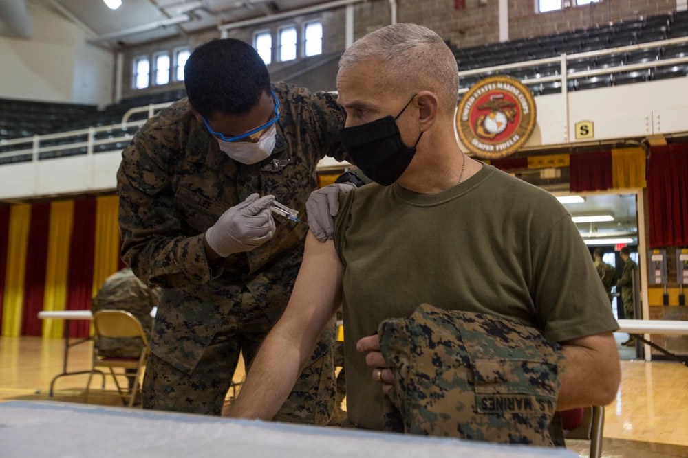 U.S. Marine Corps Brig. Gen. David Odom, deputy commanding general of II Marine Expeditionary Force and commander of 2nd Marine Expeditionary Brigade, receives the COVID vaccine at Camp Lejeune, North Carolina, Feb. 11, 2021.