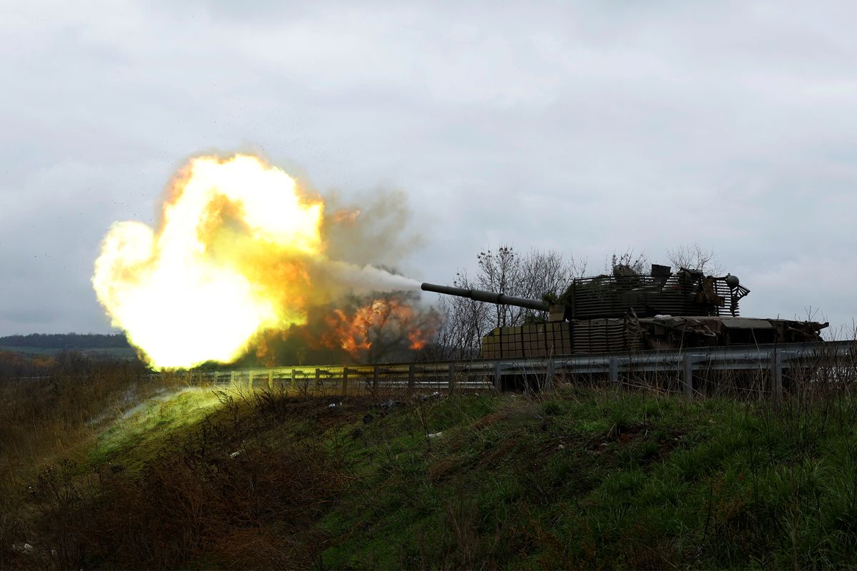 Ukrainian soldiers fire a round on the frontline from a T80 tank that was captured from Russians during a battle in Trostyanets in March, as Russia's invasion of Ukraine continues