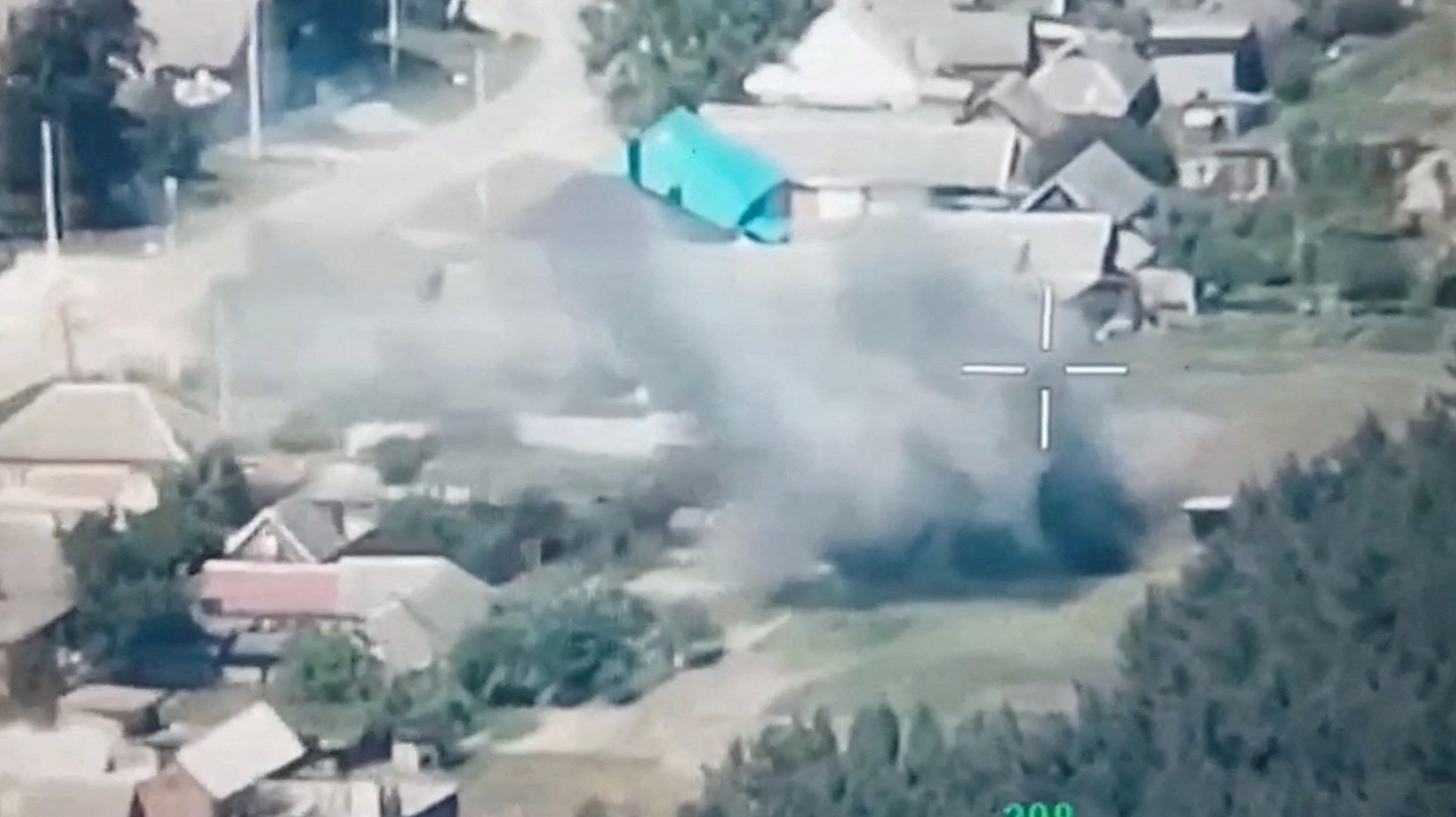 A still image from a drone footage released by Freedom of Russia Legion shows, what they claim, is a destruction of Russian military targets