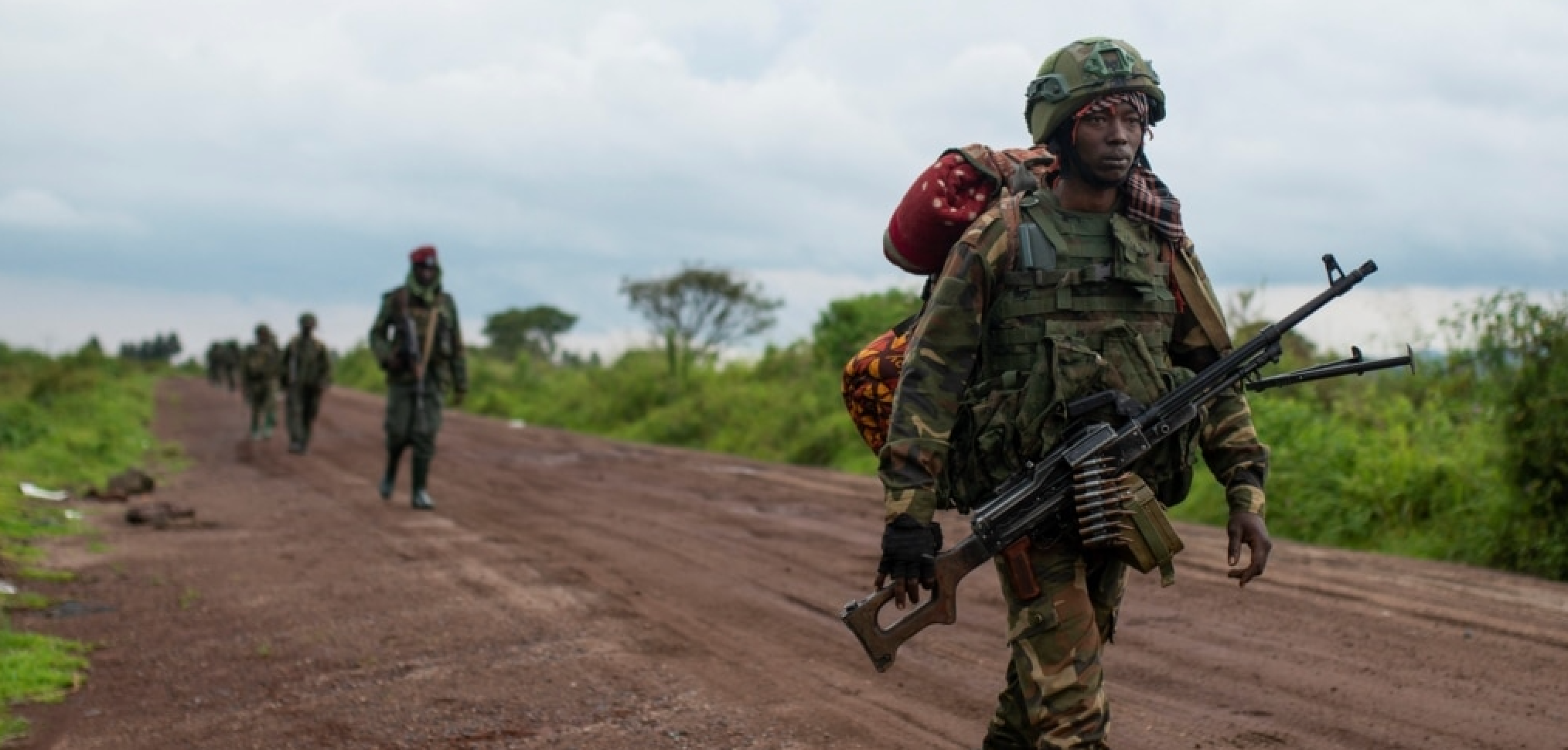 Congolese M23 rebels are seen as they withdraw from the 3 antennes location