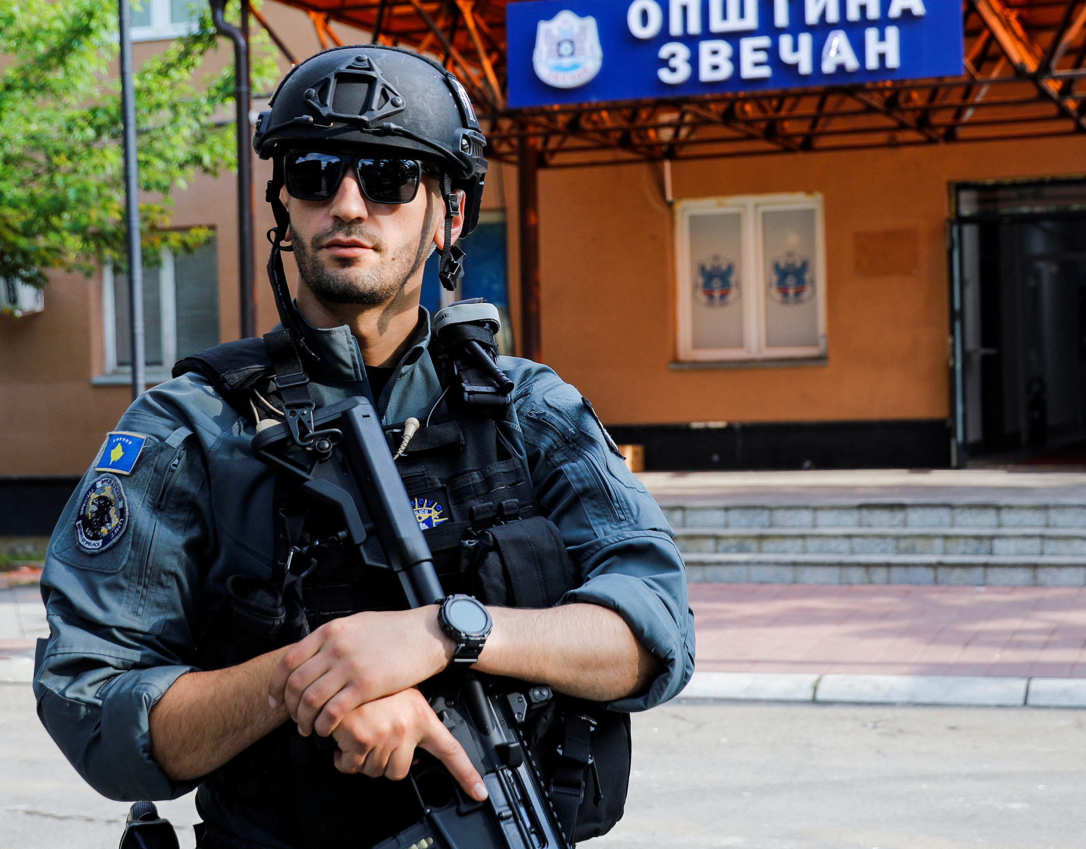 A member of Kosovo special police forces guards the municipal offices in Zvecan
