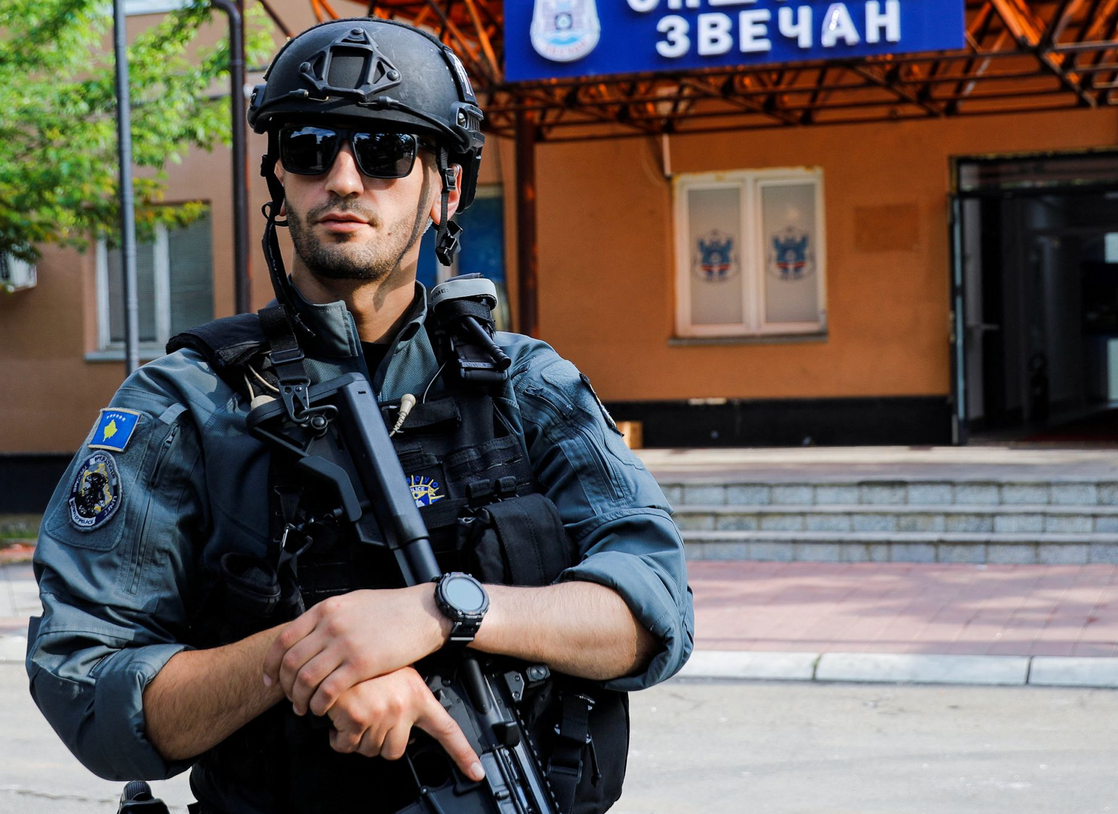 A member of Kosovo special police forces guards the municipal offices in Zveca