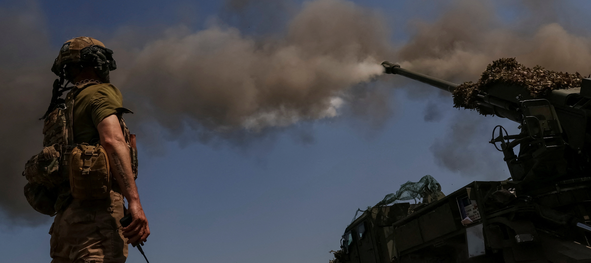 A Ukrainian serviceman of the 57th Kost Hordiienko Separate Motorised Infantry Brigade fires a 2S22 Bohdana self-propelled howitzer