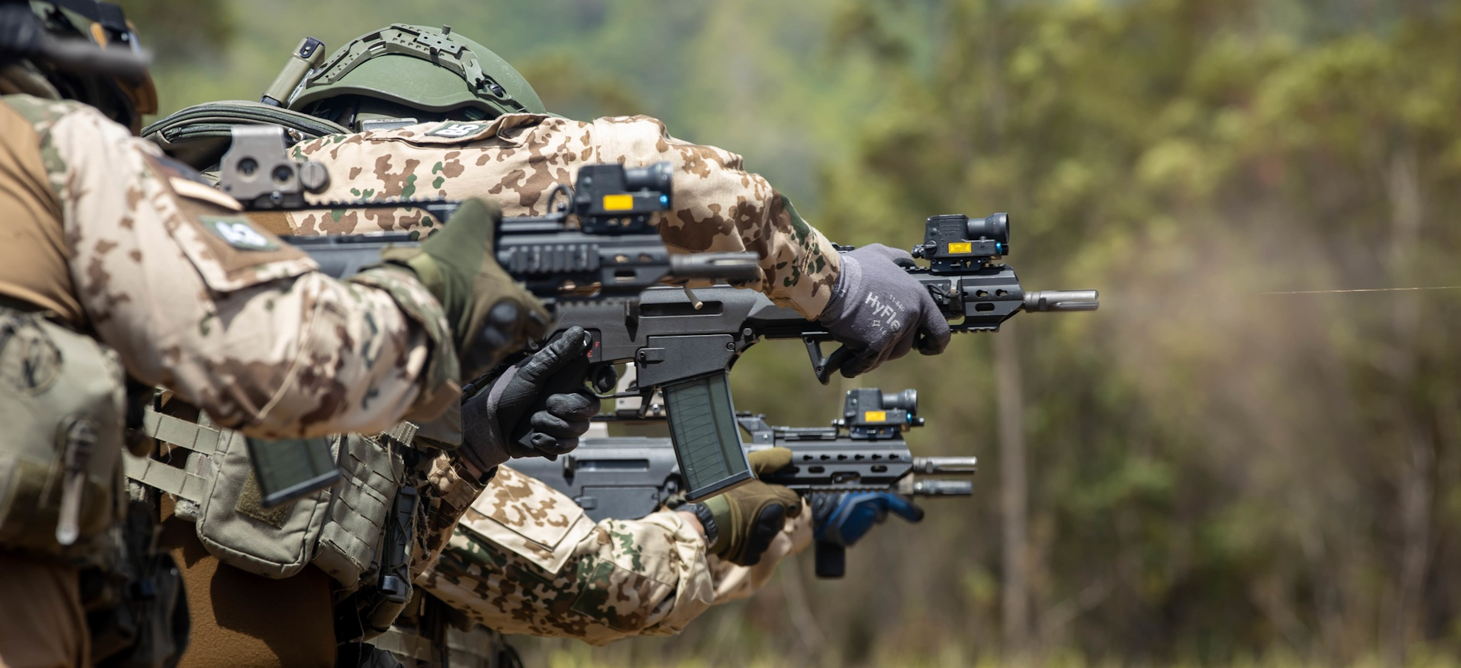 Personnel with the German Maritime Interdiction Operations Company conduct lateral drills during live-fire training during Rim of the Pacific