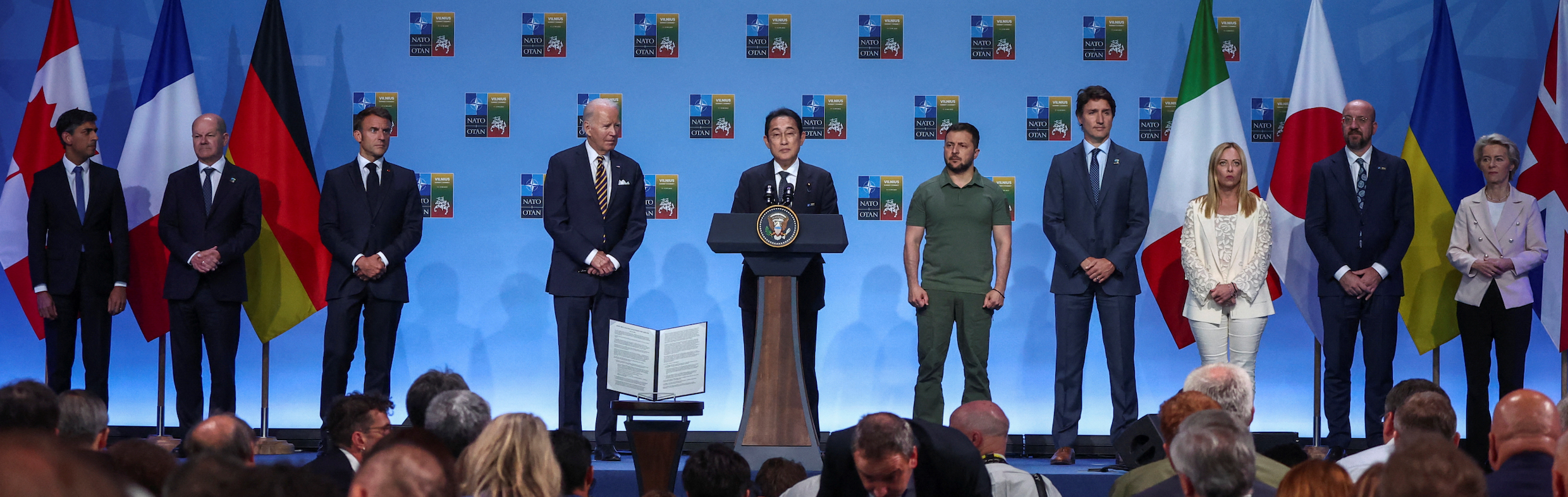 G7 leaders and Ukraine's President Volodymyr Zelenskiy are seen during the announcement