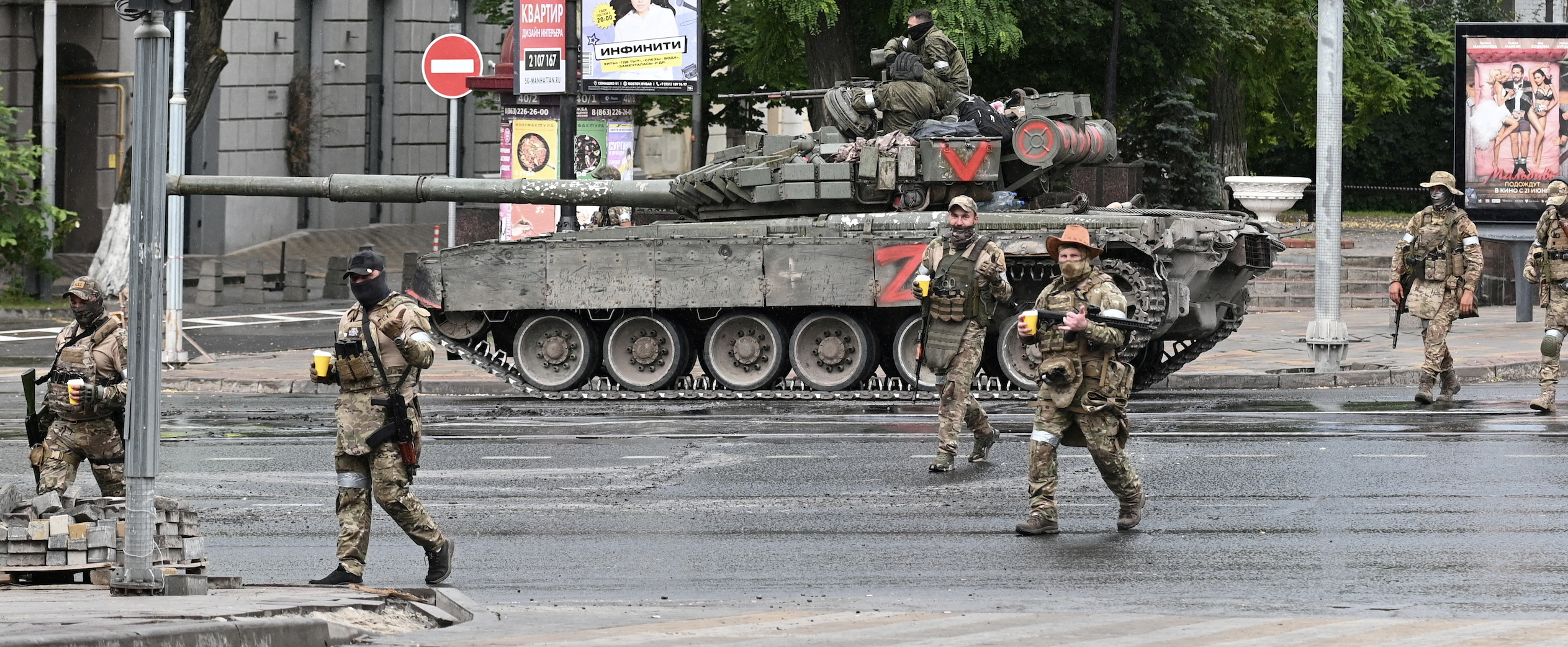 Fighters of Wagner private mercenary group cross a street