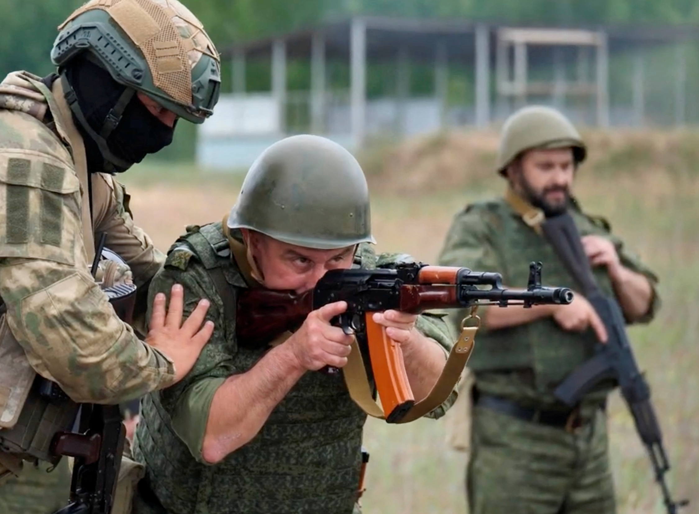 A fighter from Russian Wagner mercenary group conducts training for Belarusian soldiers