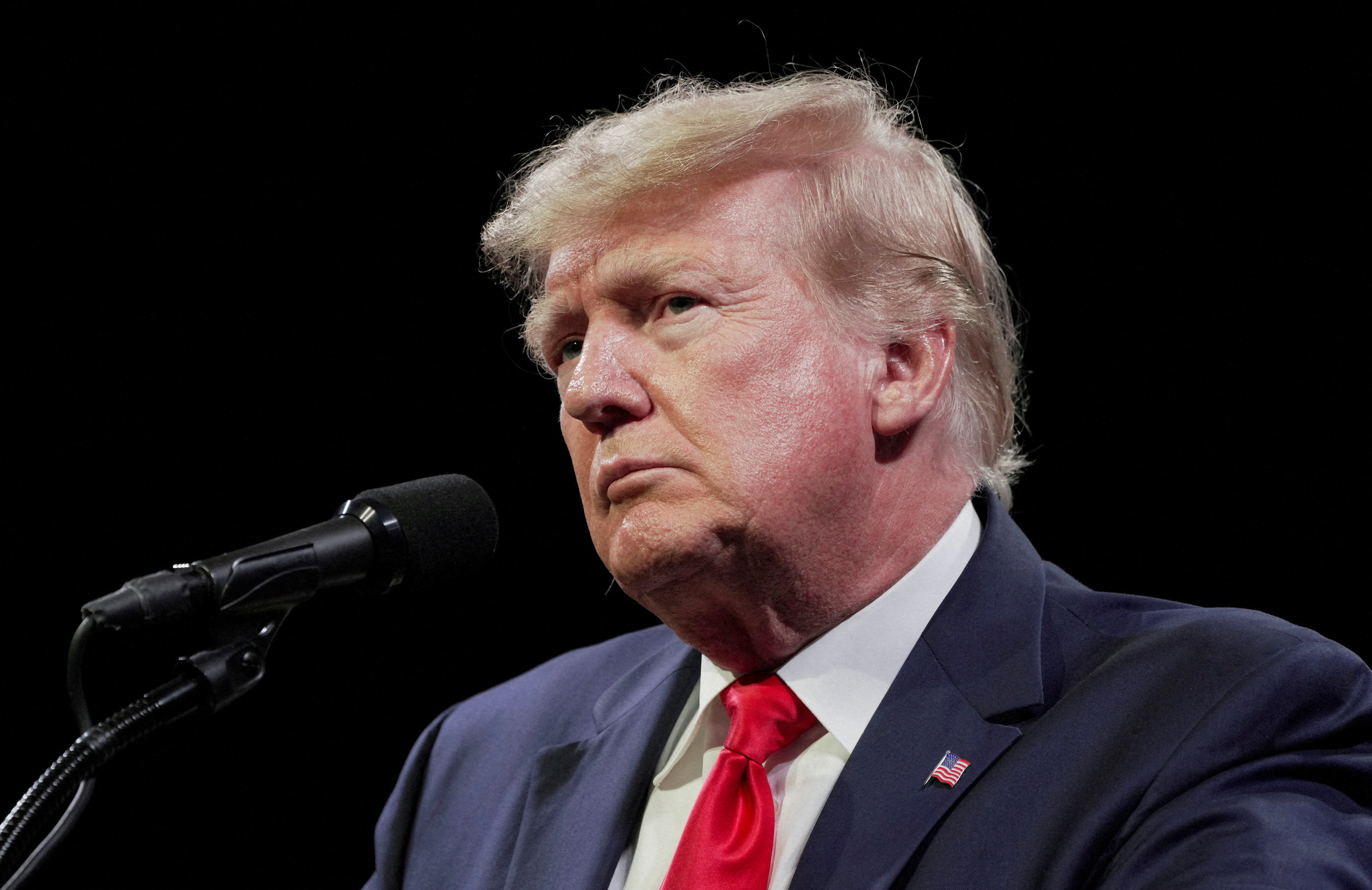 Former U.S. President Donald Trump speaks to an audience at the "American Freedom Tour"