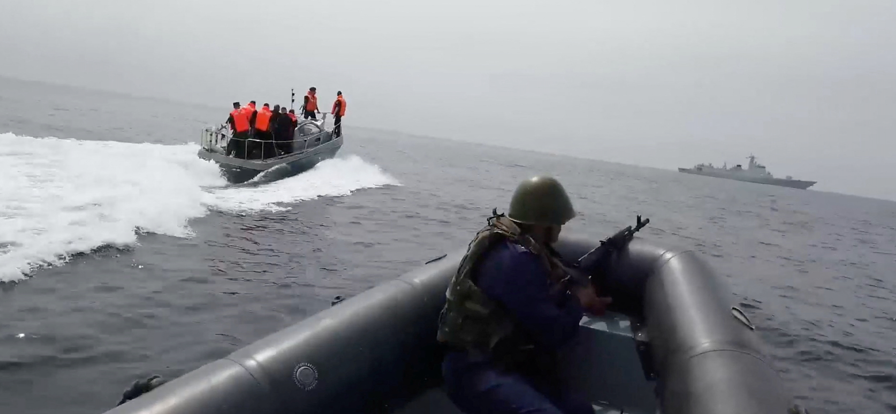 Participants sail boats during the joint Russian-Chinese naval exercise "North.Interaction - 2023" in the waters of the Sea of Japan