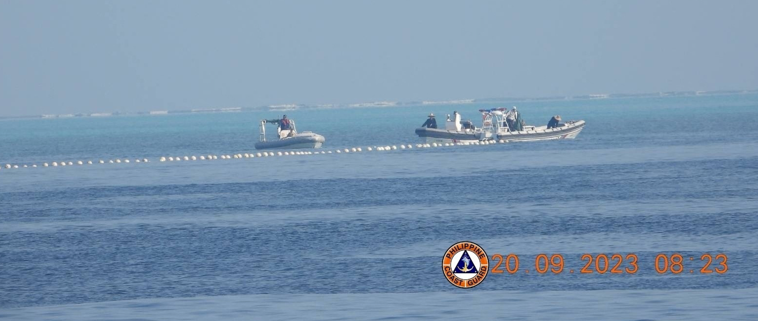 Philippines vows not to back down as China warns against “trouble” at disputed shoal