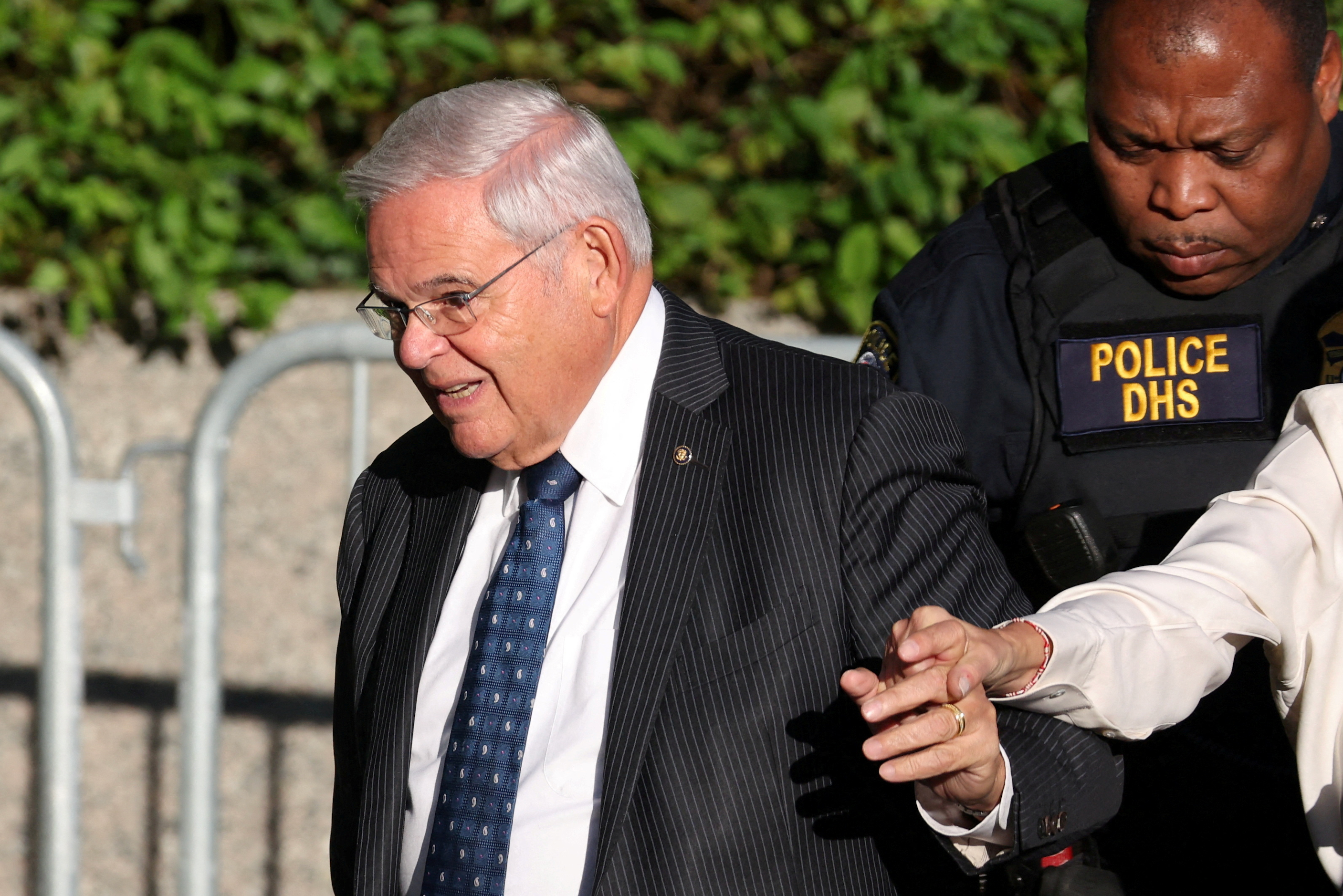 Senator Bob Menendez arrives in court as calls for resignation mount