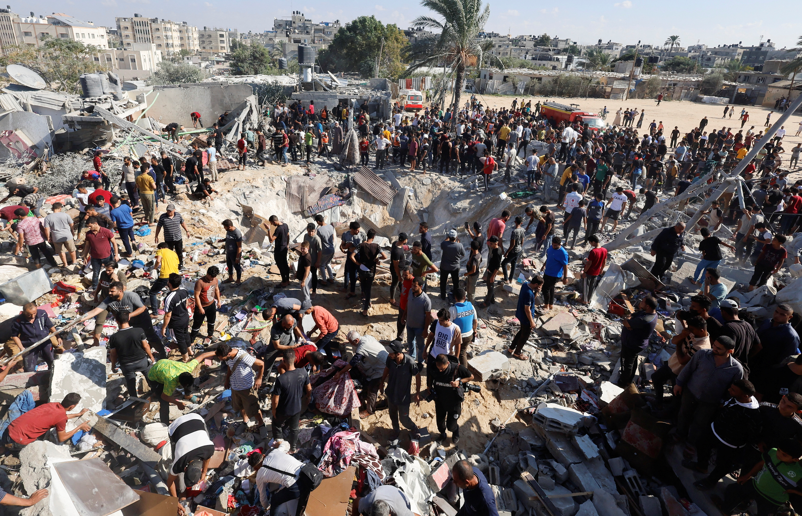 Israel levels Gaza district, hits Orthodox church as invasion looms