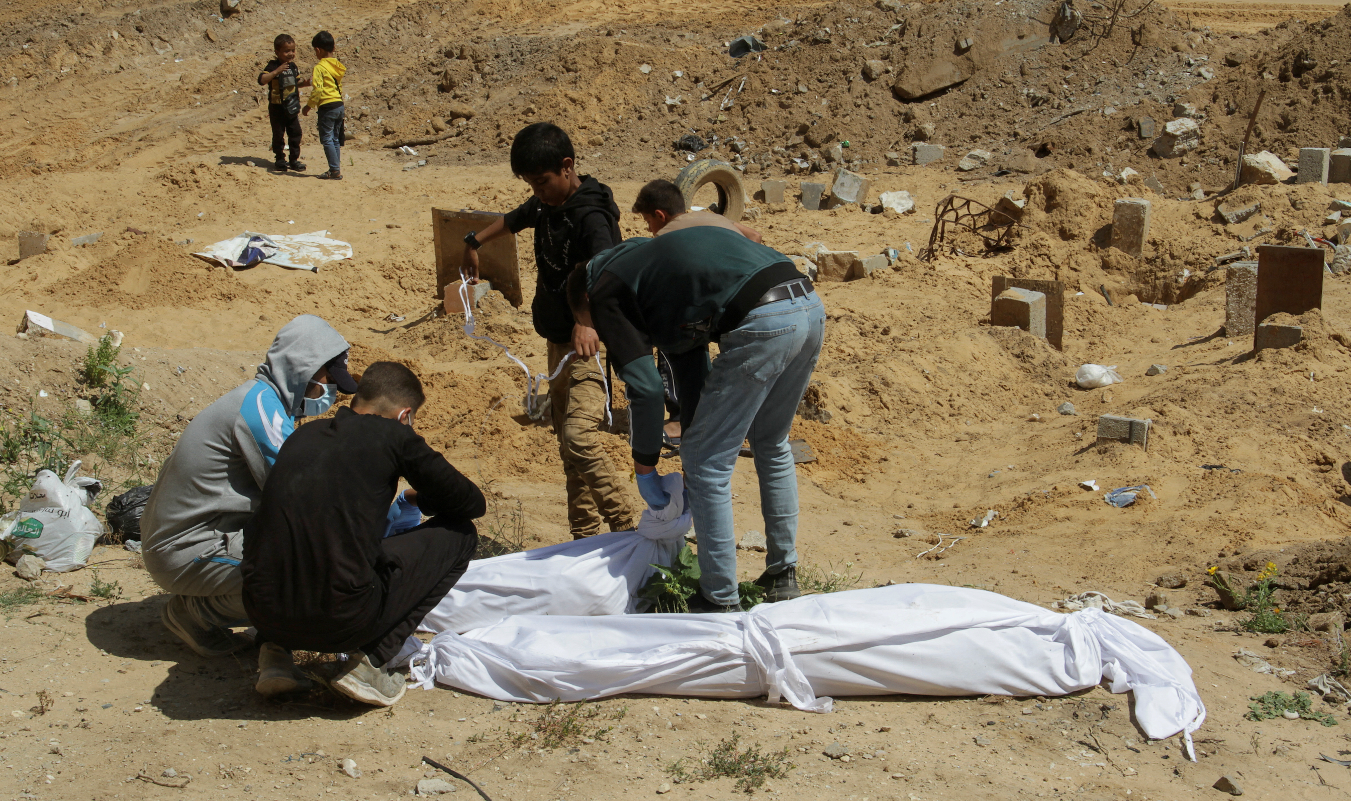 Palestinian authorities seek probe into mass graves at Gaza hospitals