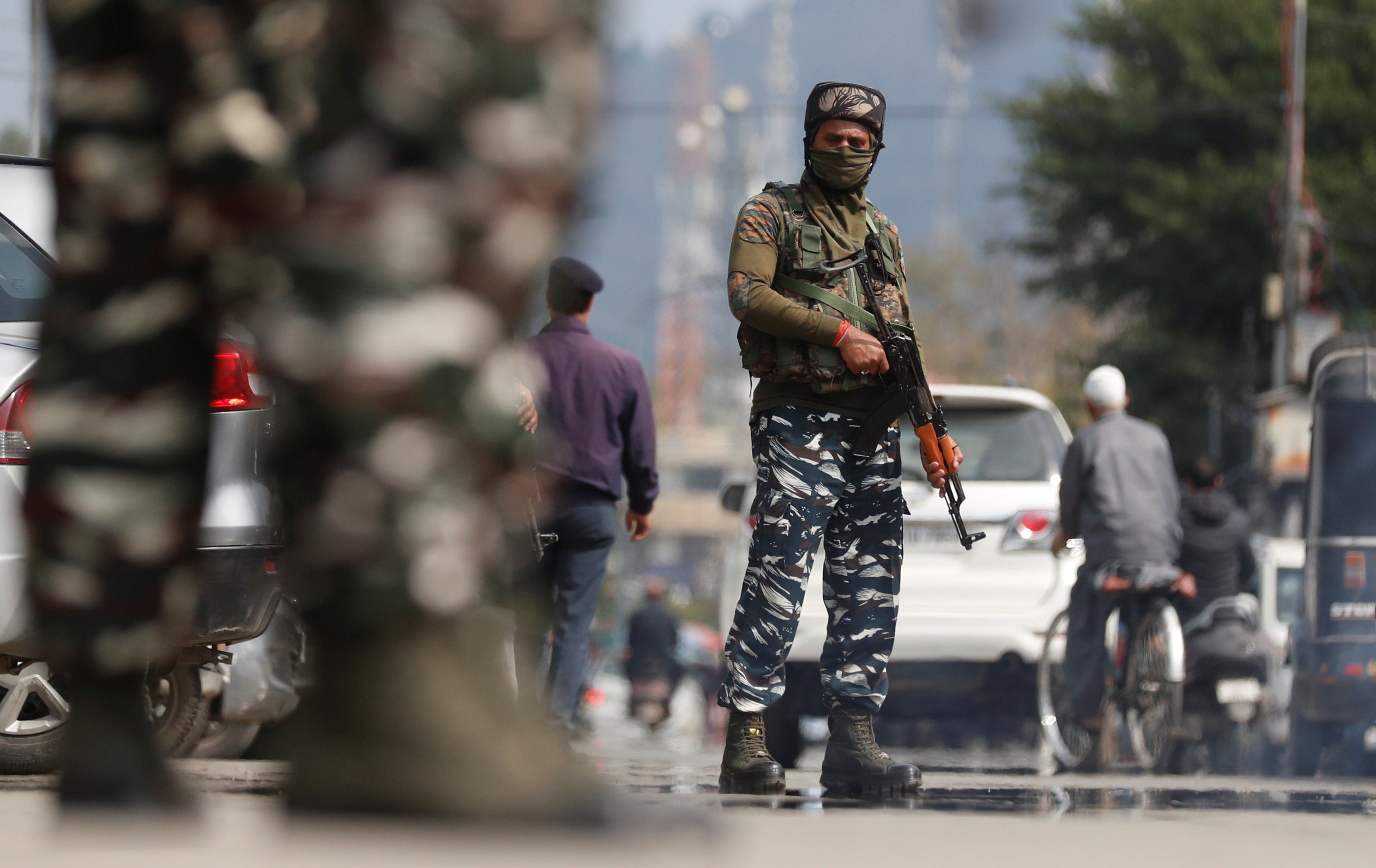 Indian Central Reserve Police Force (CRPF) personnel stand guard on a street in Srinagar