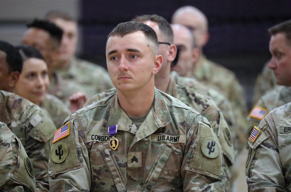 U.S. Army Reserve Sgt. Tanner Congdon receives a Purple Heart during a 103rd Sustainment Command return-home awards ceremony in Norwalk, Iowa. U.S. Army photo by Sgt. 1st Class Rodney Roldan.