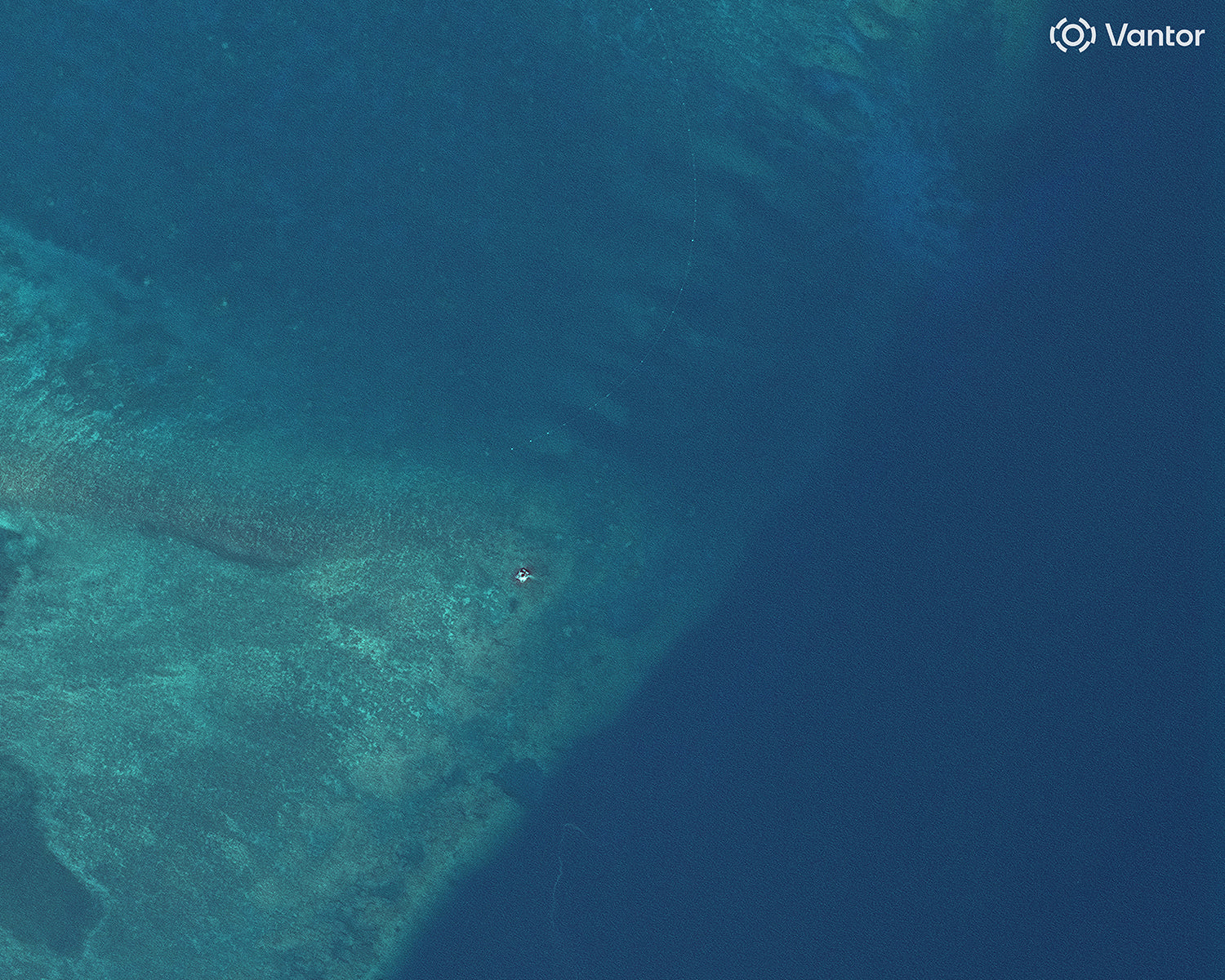 Satellite images show suspected structure at disputed South China Sea atoll, but later gone