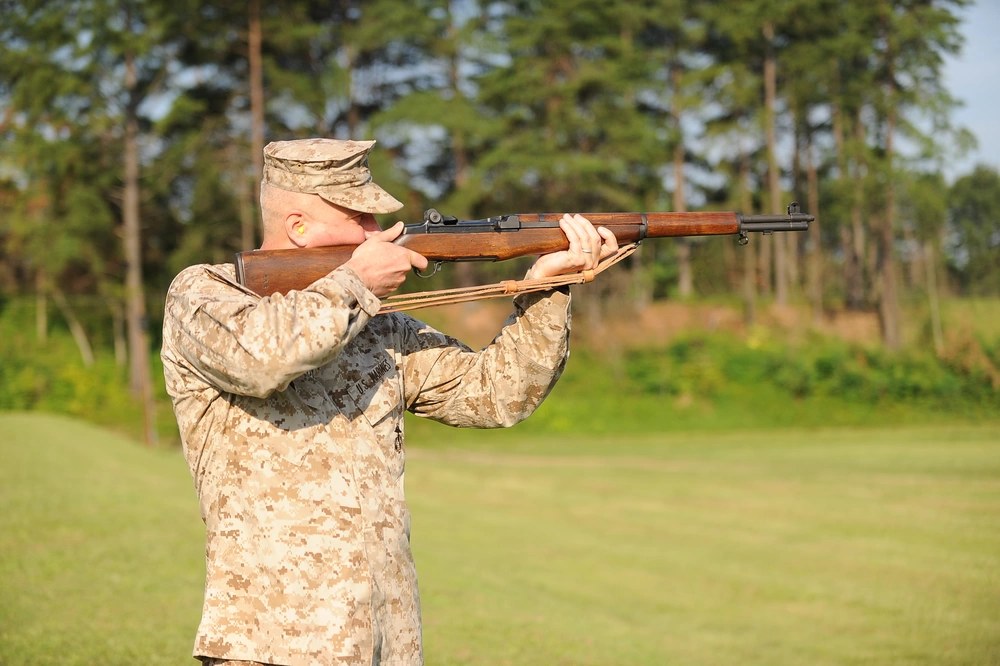 U.S. Marine Corps Sgt. Ariginald Hancock fires an M14 rifle during the Heritage Match at the Marine Corps Marksmanship Championship at Marine Corps Base Quantico, Virginia, April 11, 2025. Illustrative file photo. (U.S. Marine Corps photo by Cpl. Joshua