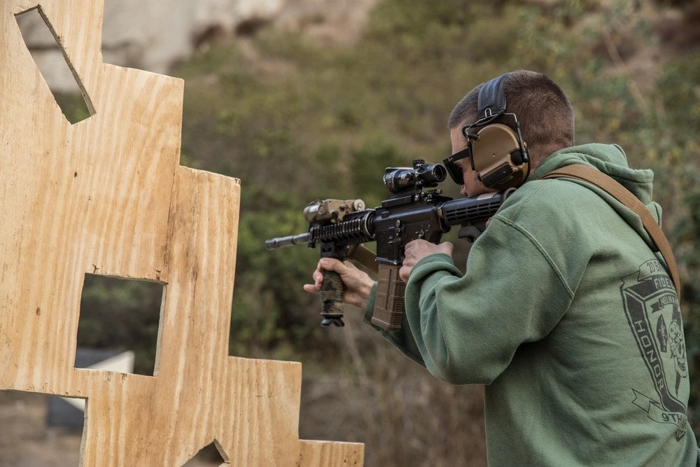“Retired U.S. Marine and Medal of Honor recipient, William Kyle Carpenter, shoots an M4 Carbine during a range event at Marine Corps Base Camp Pendleton, California, Nov. 21, 2019.”