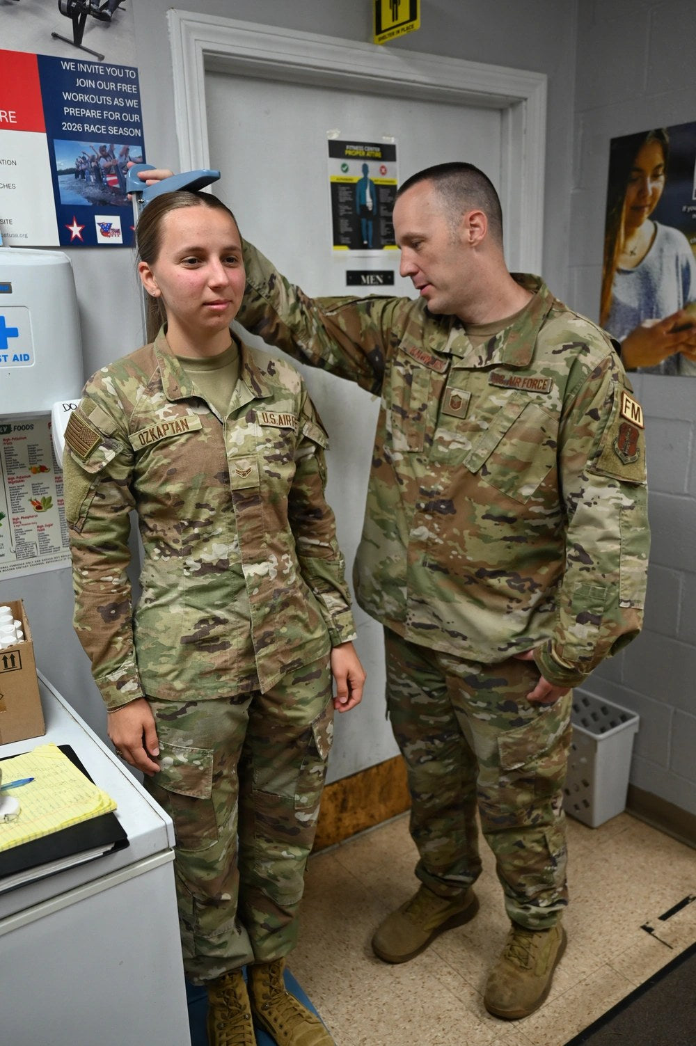 Airman 1st Class Ellen Ozkaptan, a public affairs specialist with the 104th Fighter Wing, has her height measured by Master Sgt. Jeremy Knowles during a body-composition assessment at Barnes Air National Guard Base, Massachusetts, Aug. 21, 2026. U.S. Air