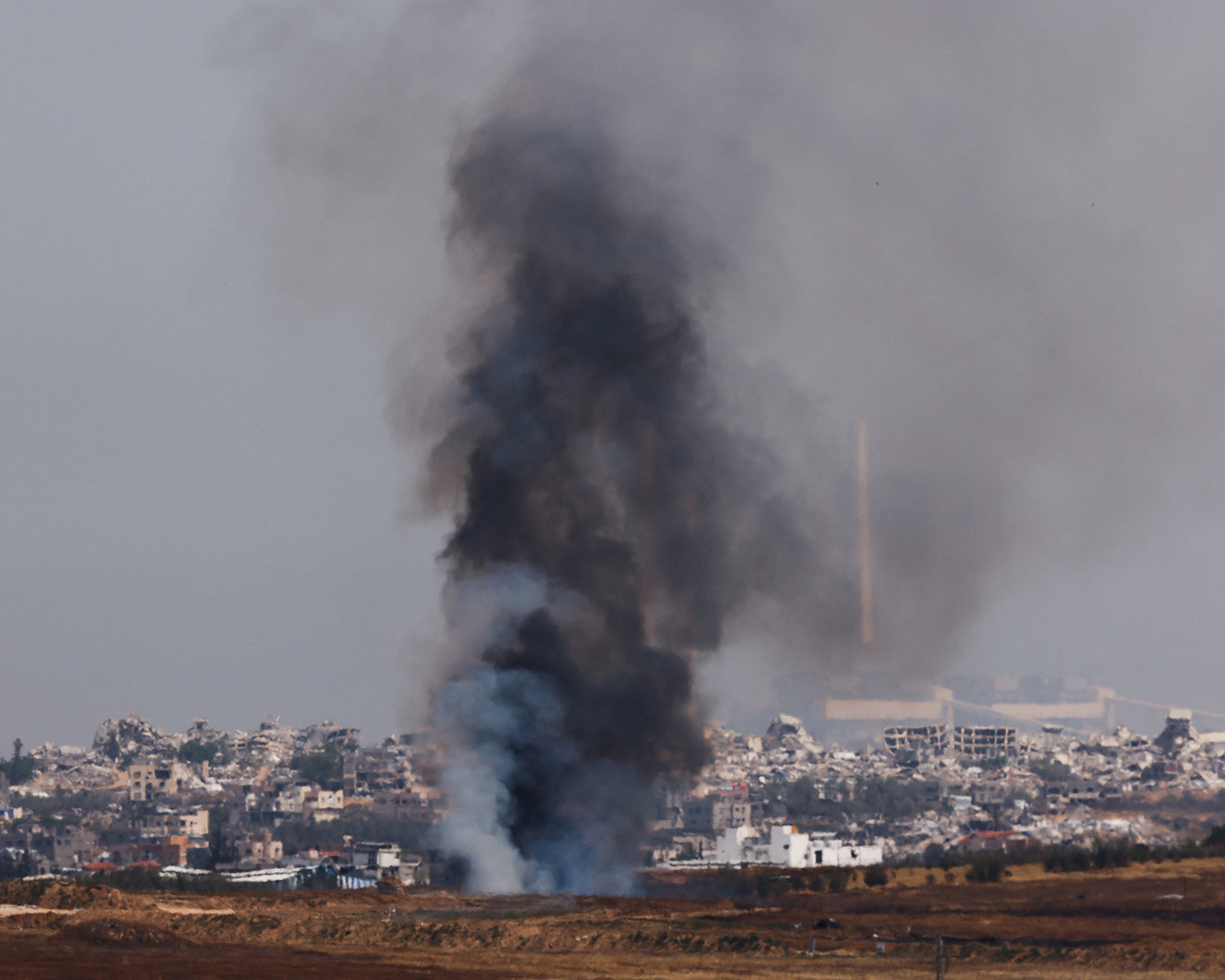Israeli strikes on school housing displaced and market kill 38 in Gaza, medics say