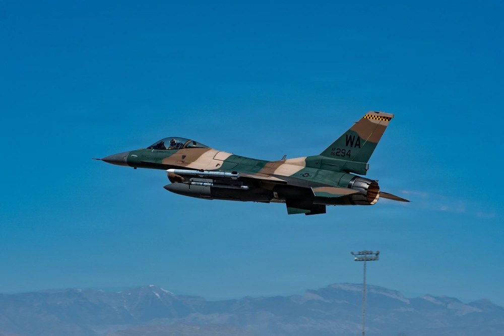 A U.S. Air Force F-16C assigned to the 64th Aggressor Squadron takes off for a training mission at Nellis Air Force Base, Nevada, June 9, 2026. A retired Air Force fighter pilot says some nondeployed fighter pilots are now getting roughly one flight per