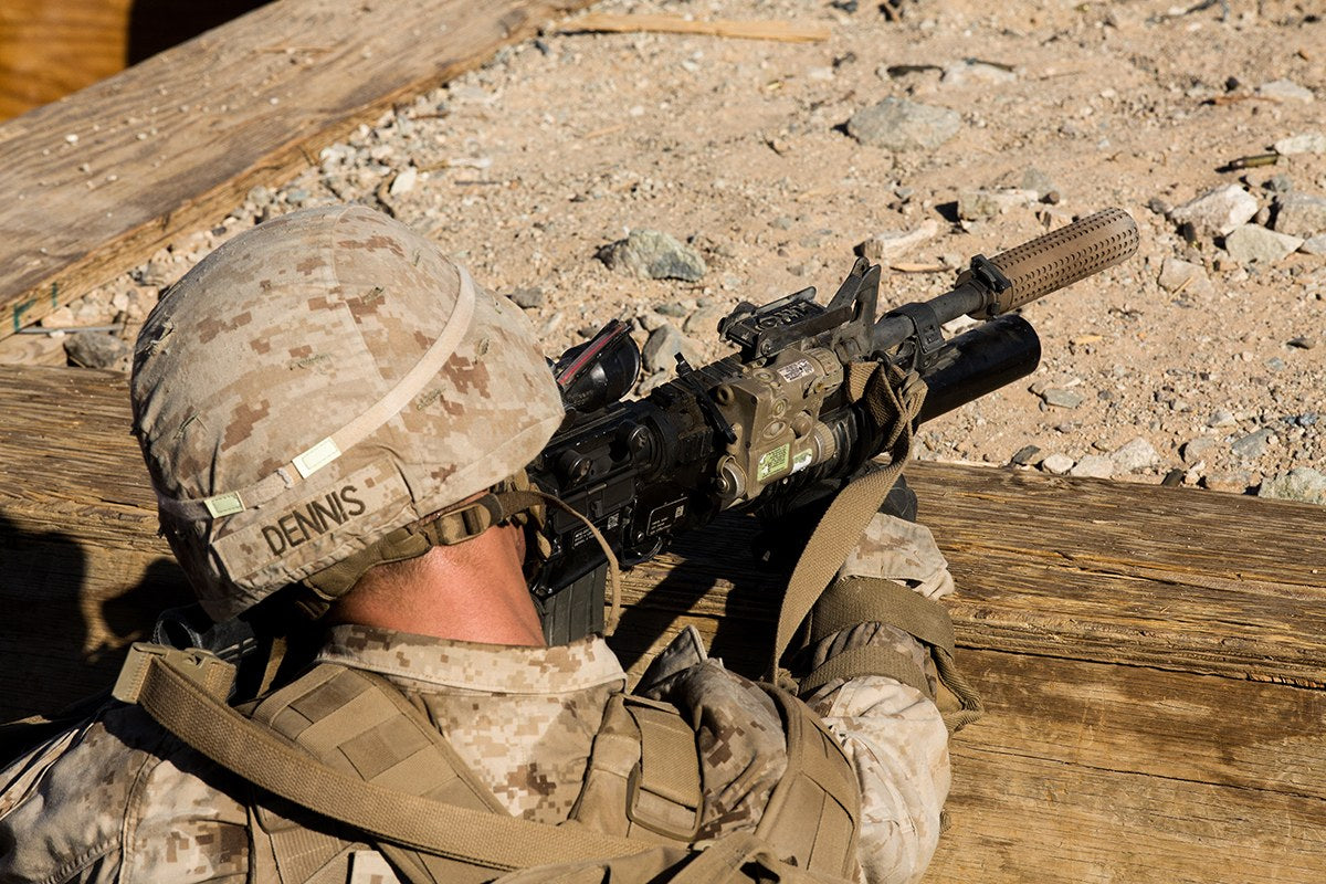 A U.S. Marine fires an M4-style rifle equipped with a suppressor during training at Marine Corps Air Ground Combat Center Twentynine Palms, California, in October 2020. The Trump administration reportedly will not appeal a federal ruling loosening some