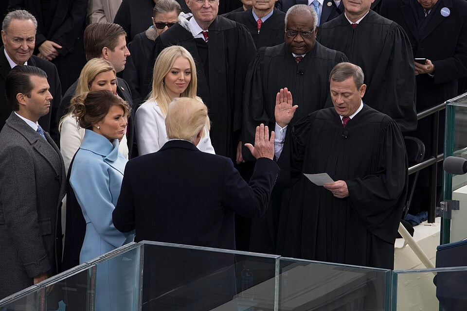 President Donald Trump takes the oath of office during the 58th Presidential Inauguration at the U.S. Capitol in Washington, D.C., Jan. 20, 2017. A new ABC News analysis says companies backed by investment firms connected to Donald Trump Jr. and Eric