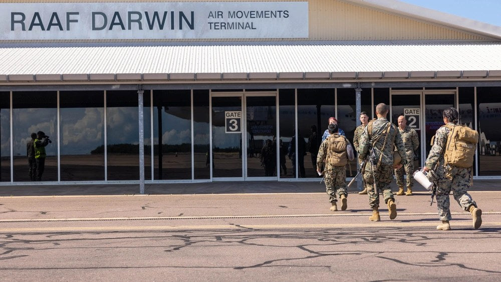 U.S. Marines arrive at RAAF Base Darwin in Australia. An intruder allegedly breached the installation Sept. 14, assaulted a security officer and escaped in a stolen security vehicle. The personnel pictured were not involved in the incident.