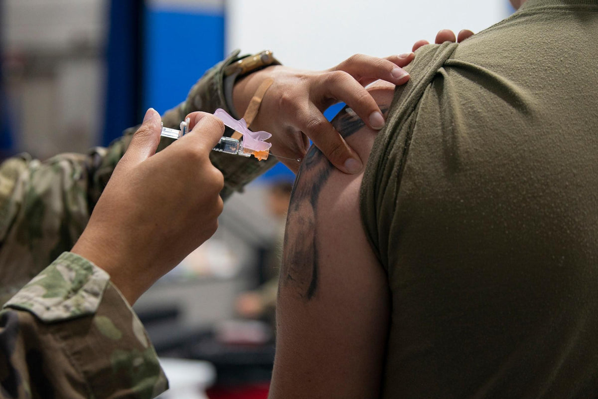 An Air Force medical professional administers an influenza vaccine to an airman at Moody Air Force Base, Georgia, on November 16, 2022. New Air Force guidance dated October 20, 2026, restores mandatory flu shots for designated personnel, including