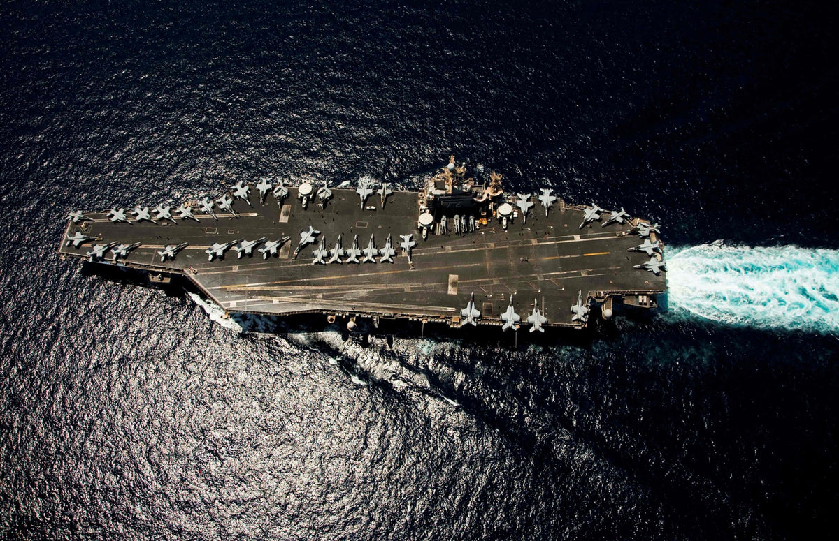 The aircraft carrier USS Abraham Lincoln operates in the Arabian Sea on May 8, 2026. A 19-year-old sailor assigned to the carrier has received a general discharge following an August mental health crisis and subsequent disciplinary proceedings. His