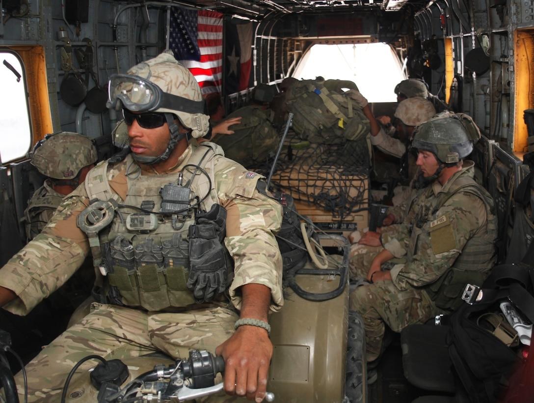 British soldiers from 1st Battalion, The Parachute Regiment, prepare for a helicopter mission in Afghanistan in April 2011. Five British SAS soldiers faced a nearly three-year murder investigation following a separate 2022 mission against ISIS in Syria.