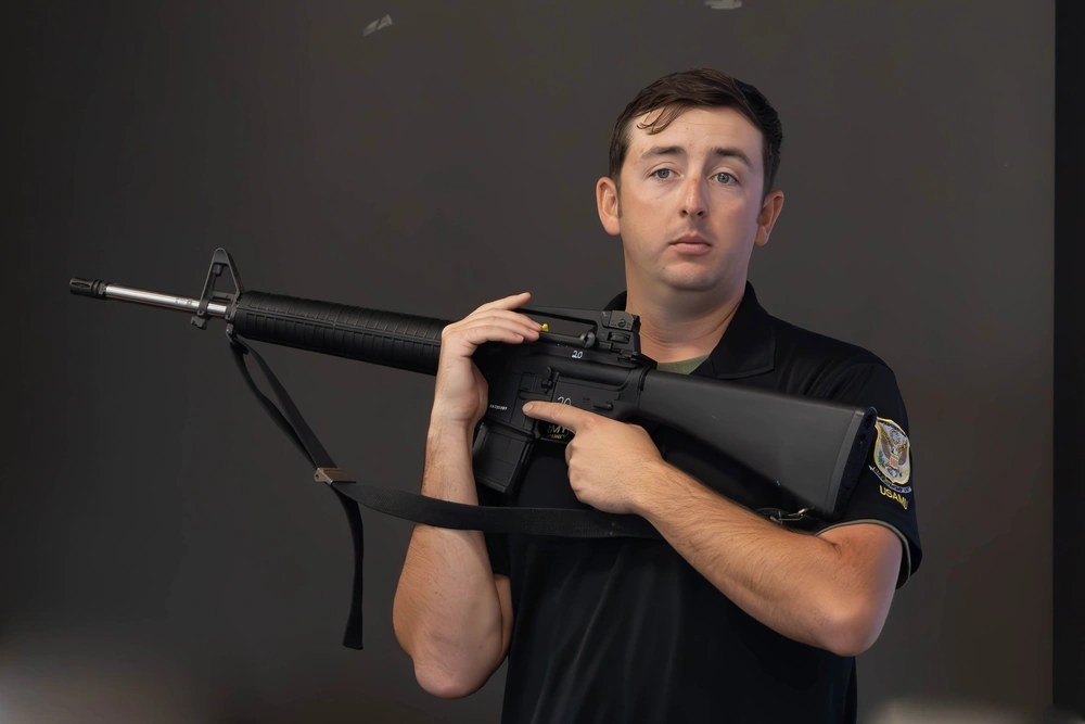 U.S. Army Staff Sgt. Verne Conant, an instructor with the U.S. Army Marksmanship Unit, demonstrates with an AR-15 during a Civilian Marksmanship Program Rifle Marksmanship 101 course at Talladega Marksmanship Park in Alabama, Nov. 7, 2024. (U.S. Army