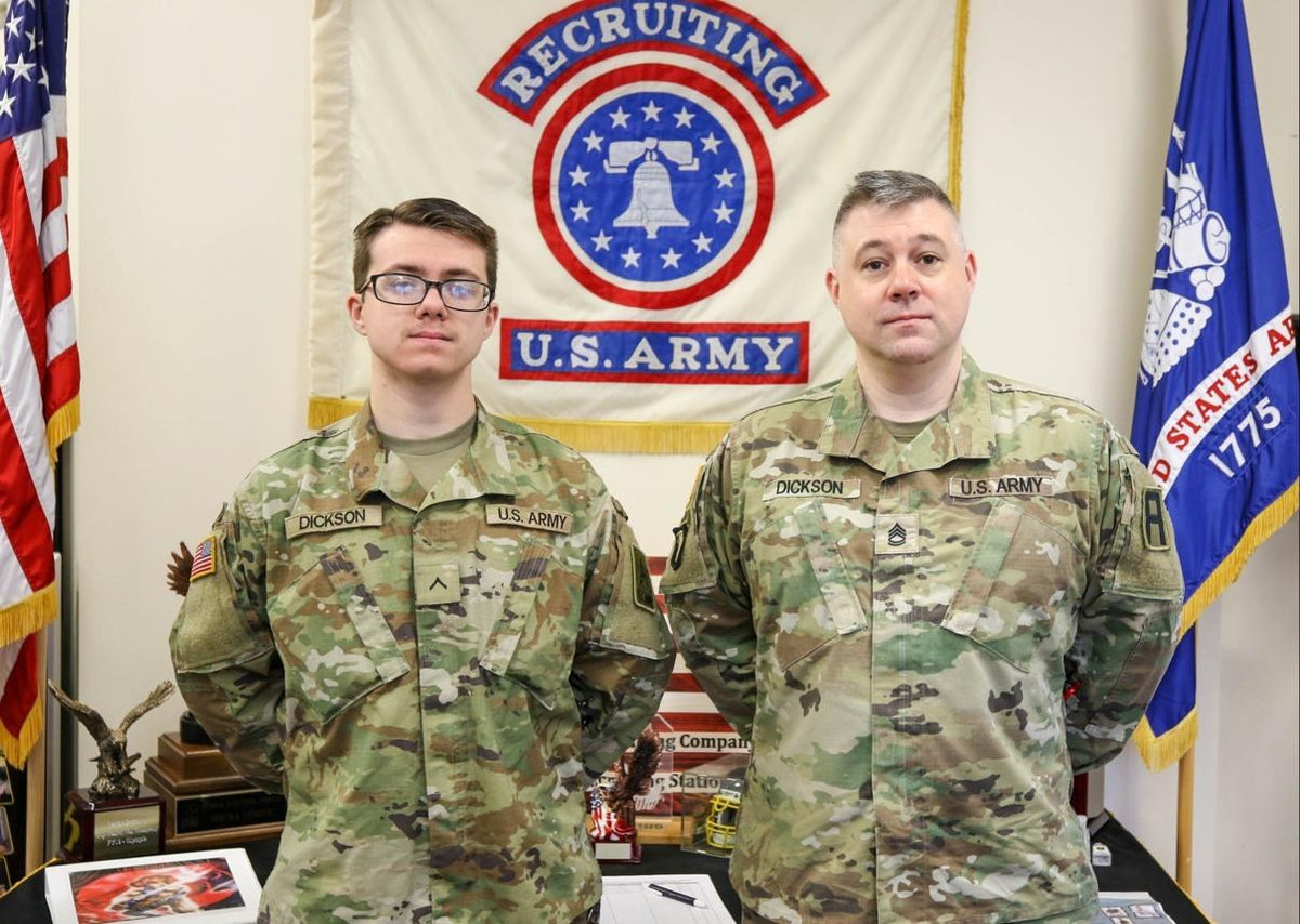 Pvt. Alexander Dickson, left, stands with Sgt. 1st Class Nathan Dickson at the Lacey Recruiting Station in Washington while participating in the Army's Hometown Recruiter Assistance Program on Nov. 30, 2023. U.S. Army photo by Sgt. 1st Class Scott Evans.