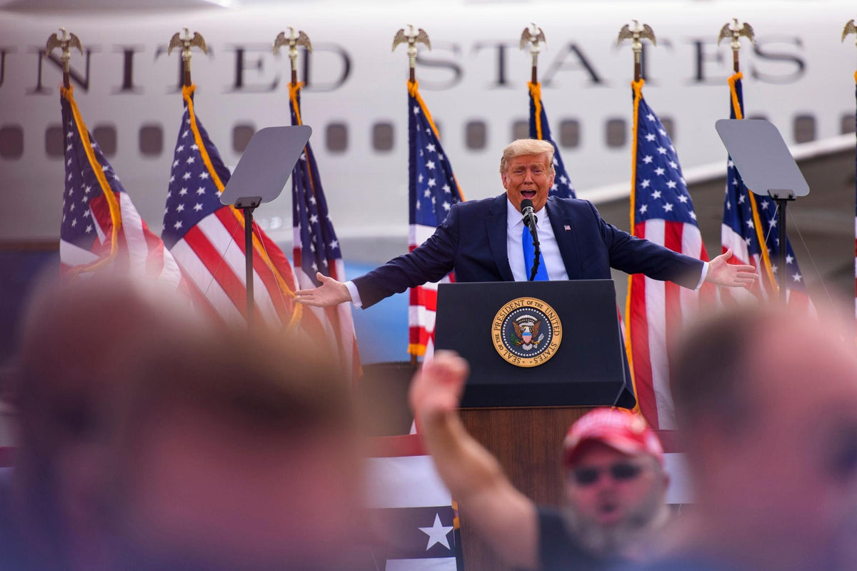 President Donald Trump speaks during a campaign rally at Pitt-Greenville Airport in Greenville, North Carolina, on October 20, 2026. Trump said he would move to settle remaining Camp Lejeune water-contamination claims if Republicans retain control of