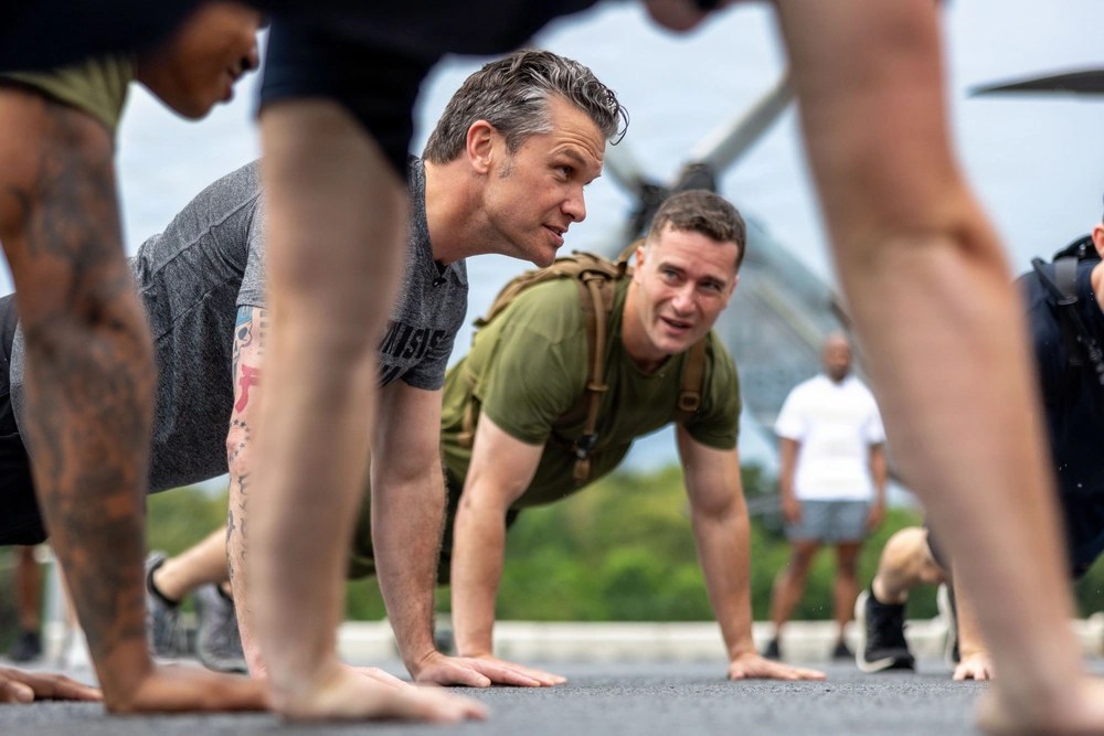 Pete Hegseth conducts physical training with U.S. Marines and sailors aboard USS Boxer in Singapore on May 29, 2026. U.S. Marine Corps photo by Sgt. Trent A. Henry