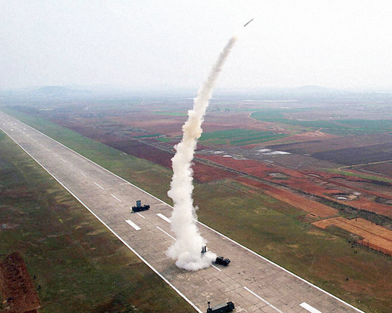 North Korea leader Kim oversees firing of new air defense missiles, KCNA says