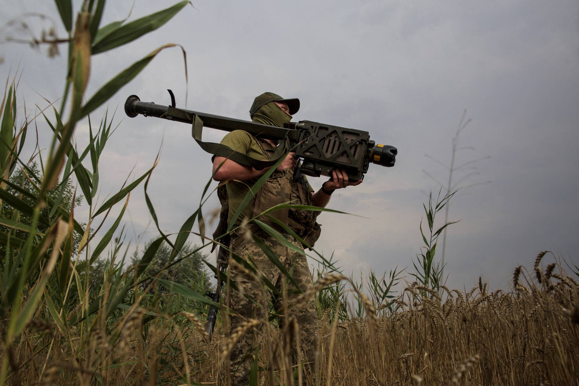 A Ukrainian serviceman holds a Stinger anti-aircraft missile on a front line in Ukraine's Mykolaiv region