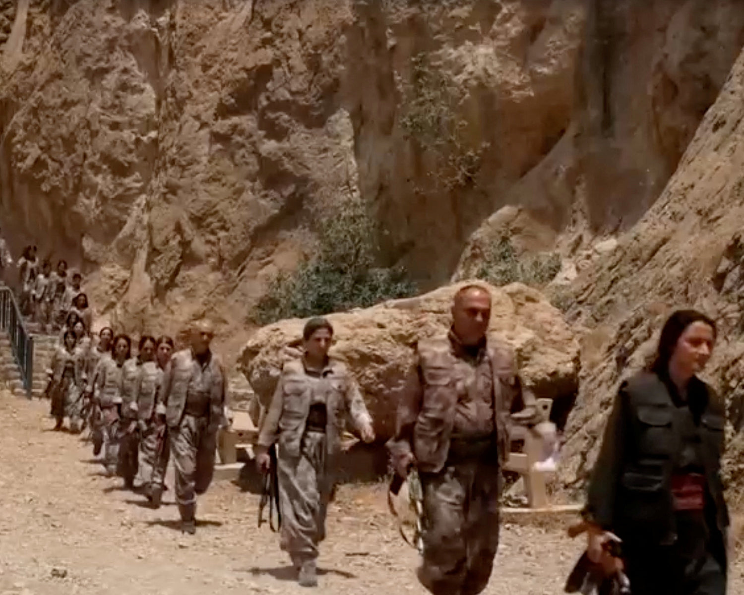 Kurdish PKK militants burn weapons in Iraq to start disarmament