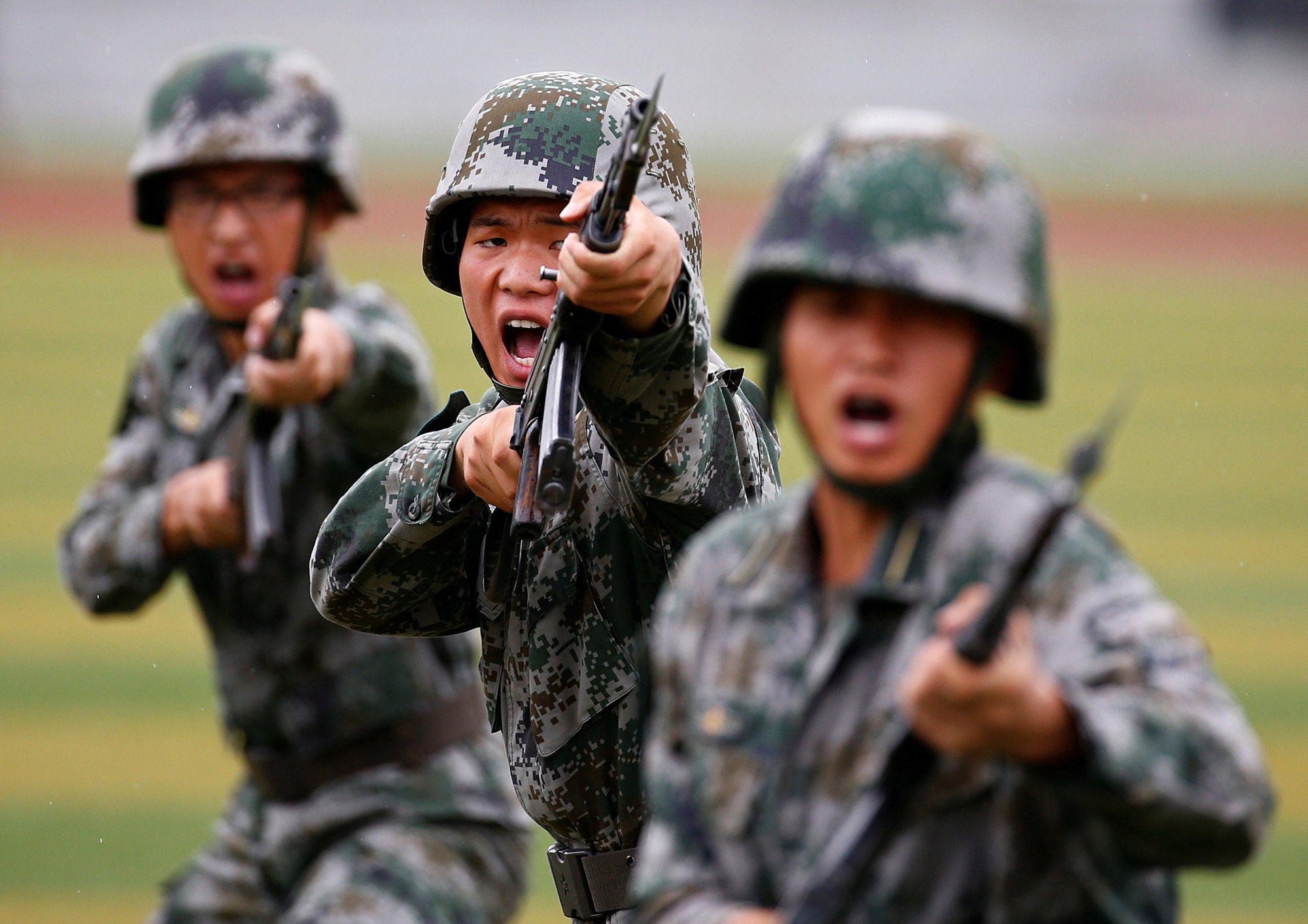 Chinese People's Liberation Army soldiers hold a drill during a media tour at a PLA engineering school