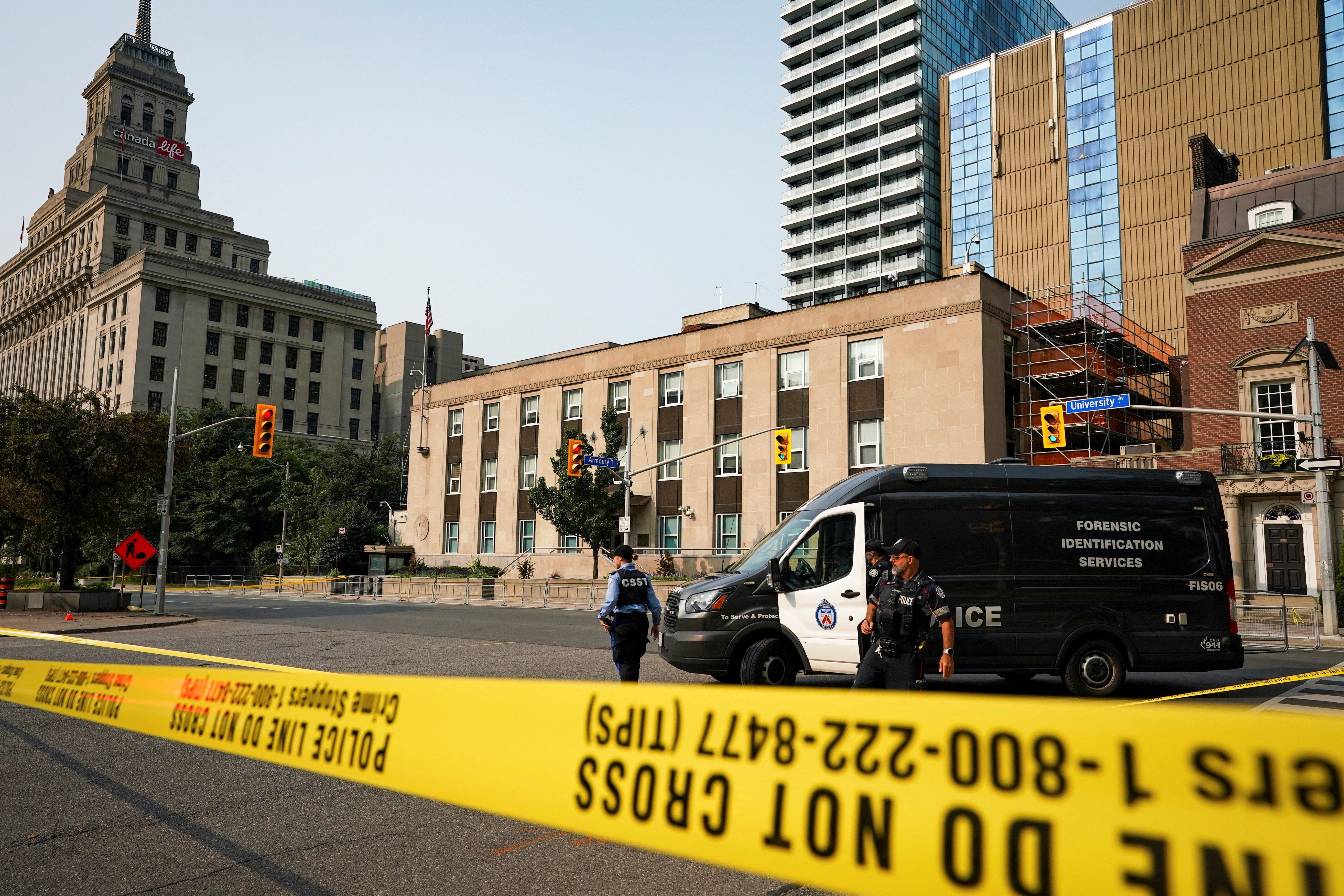 Toronto Police officers work at the scene of a shooting at the U.S. Consulate in Toronto, Ontario, Canada July 27, 2026. REUTERS/Arlyn McAdorey