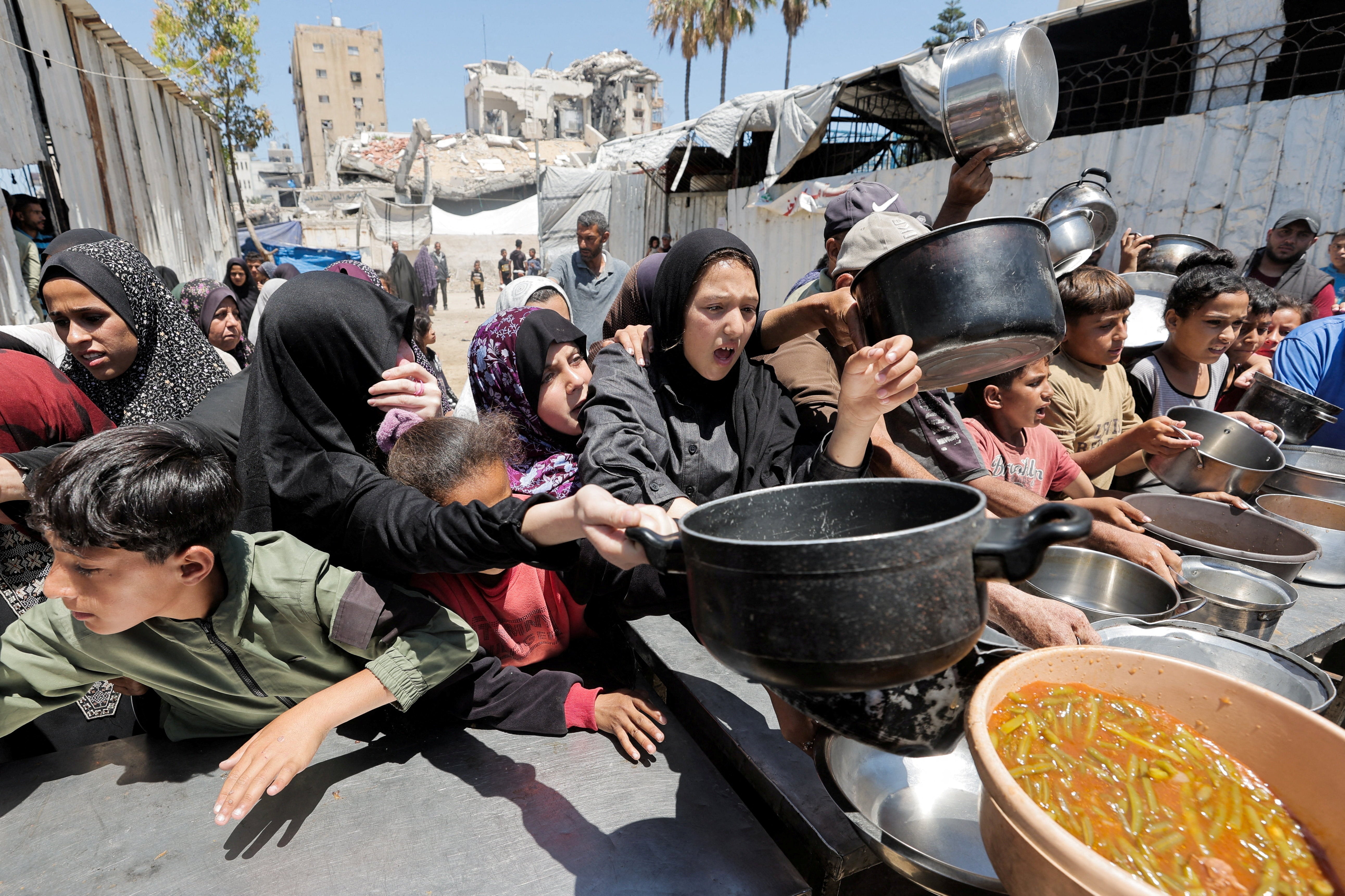 Palestinians gather to receive food from a charity kitchen, in Gaza City, June 2, 2026. REUTERS/Dawoud Abu Alkas