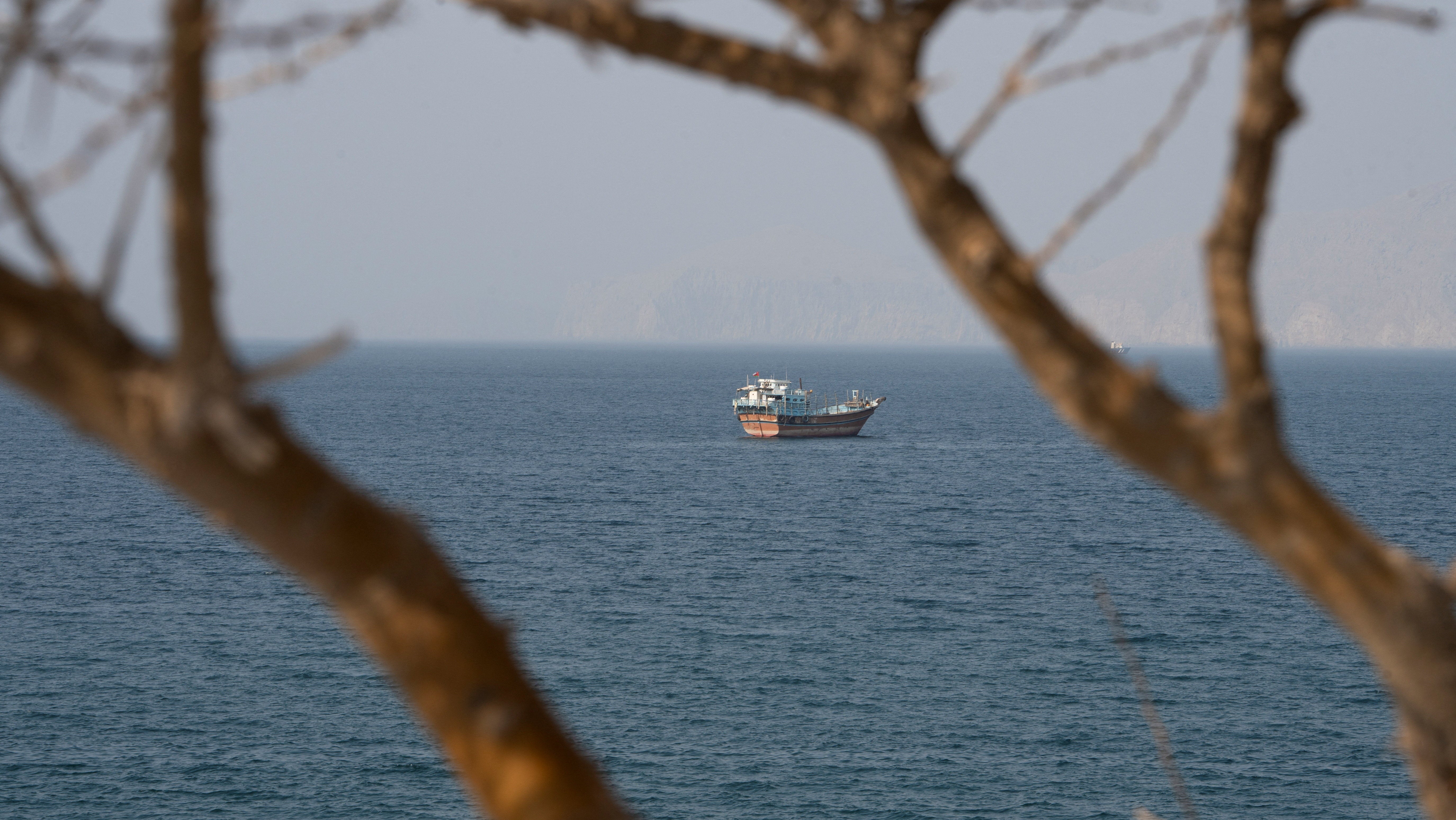 A vessel near the Strait of Hormuz, as seen from Musandam, Oman, August 17, 2026. REUTERS/Stringer