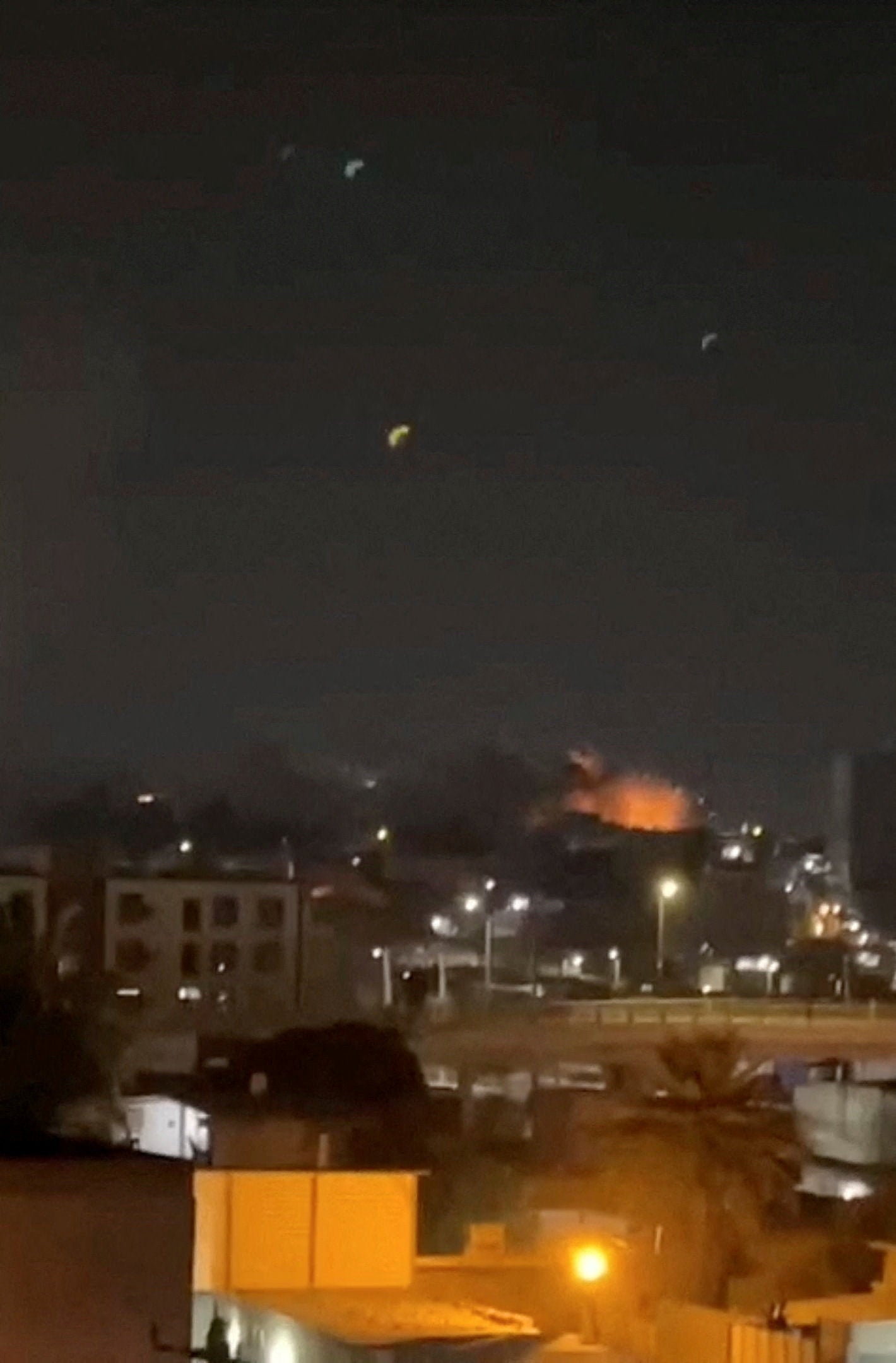Smoke and flames rise after an explosion in Bandar Abbas, Hormozgan Province, Iran, July 24, 2026, in this screengrab obtained from a social media video. Social Media/via REUTERS