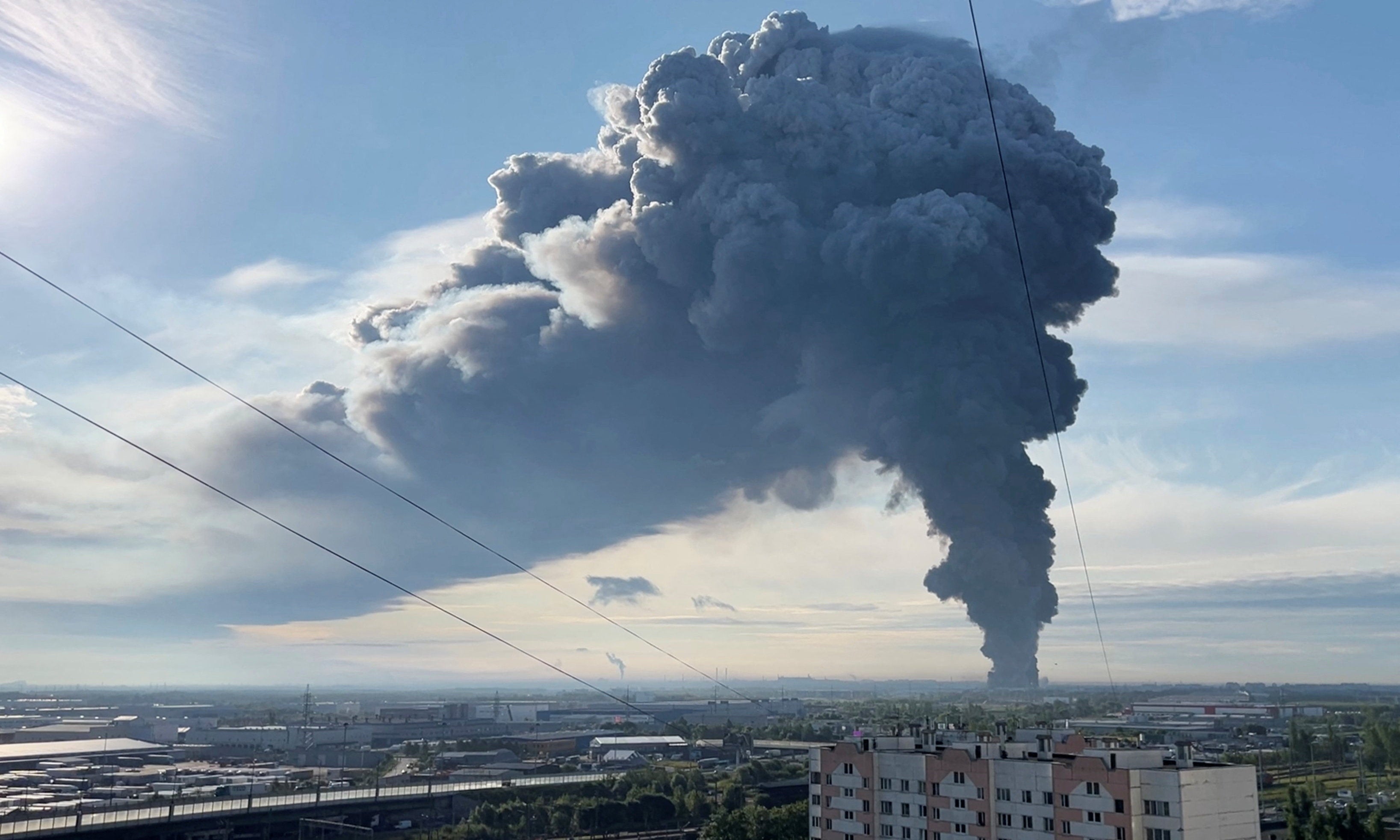 Smoke billows from the burning Wildberries warehouse following a Ukrainian drone attack, according to local authorities, in the course of the Russia-Ukraine conflict, in Saint Petersburg, Russia July 24, 2026, in this still image taken from video.